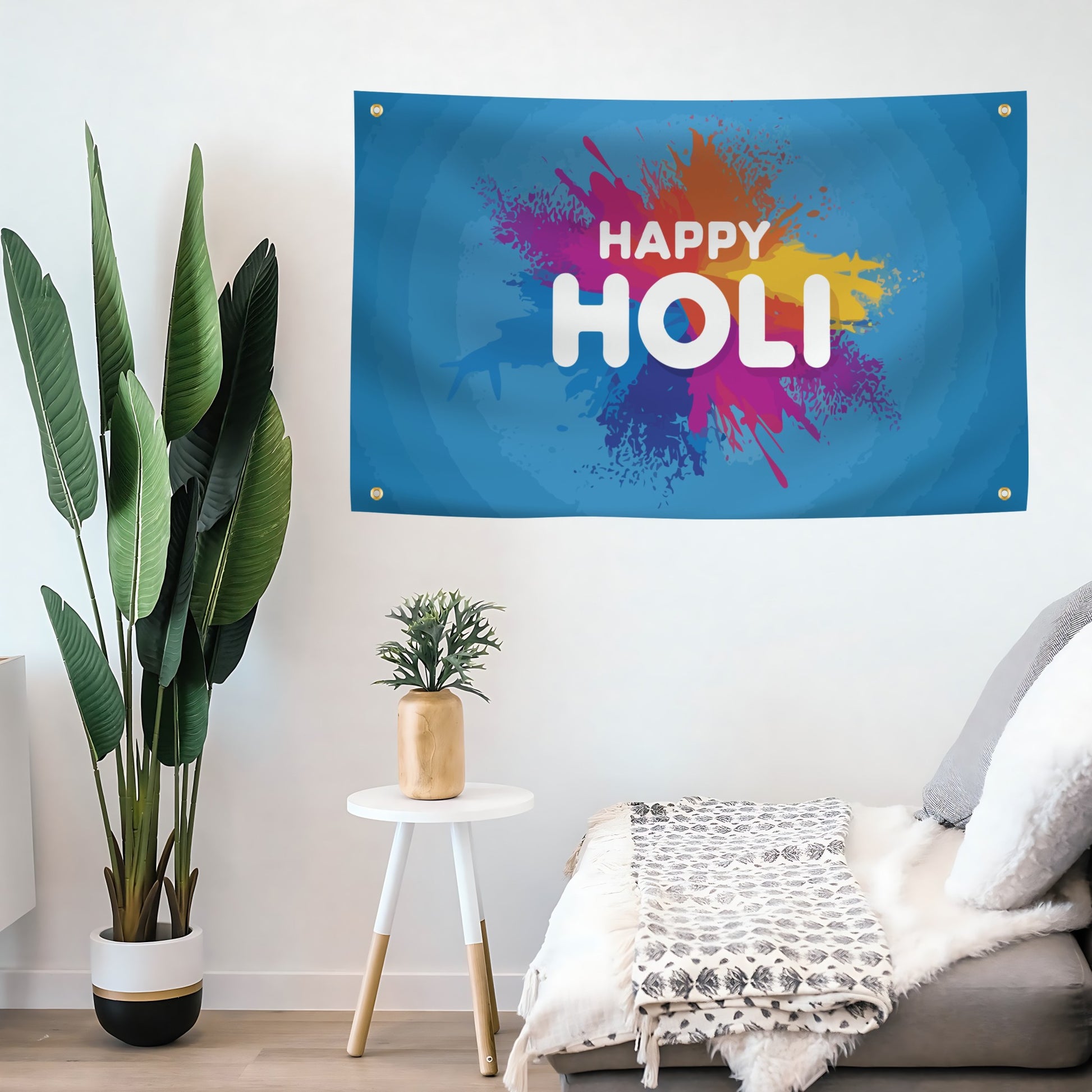 A rectangular banner with a blue background featuring a multicolored paint splash design and the text 'HAPPY HOLI' in white.