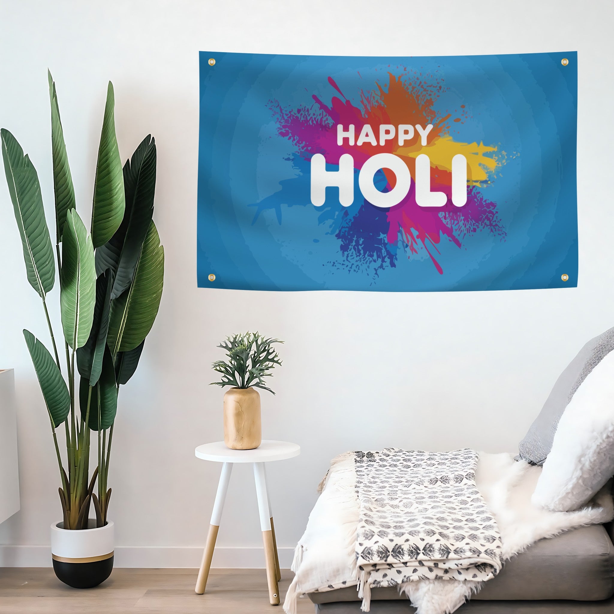 A rectangular banner with a blue background featuring a multicolored paint splash design and the text 'HAPPY HOLI' in white.