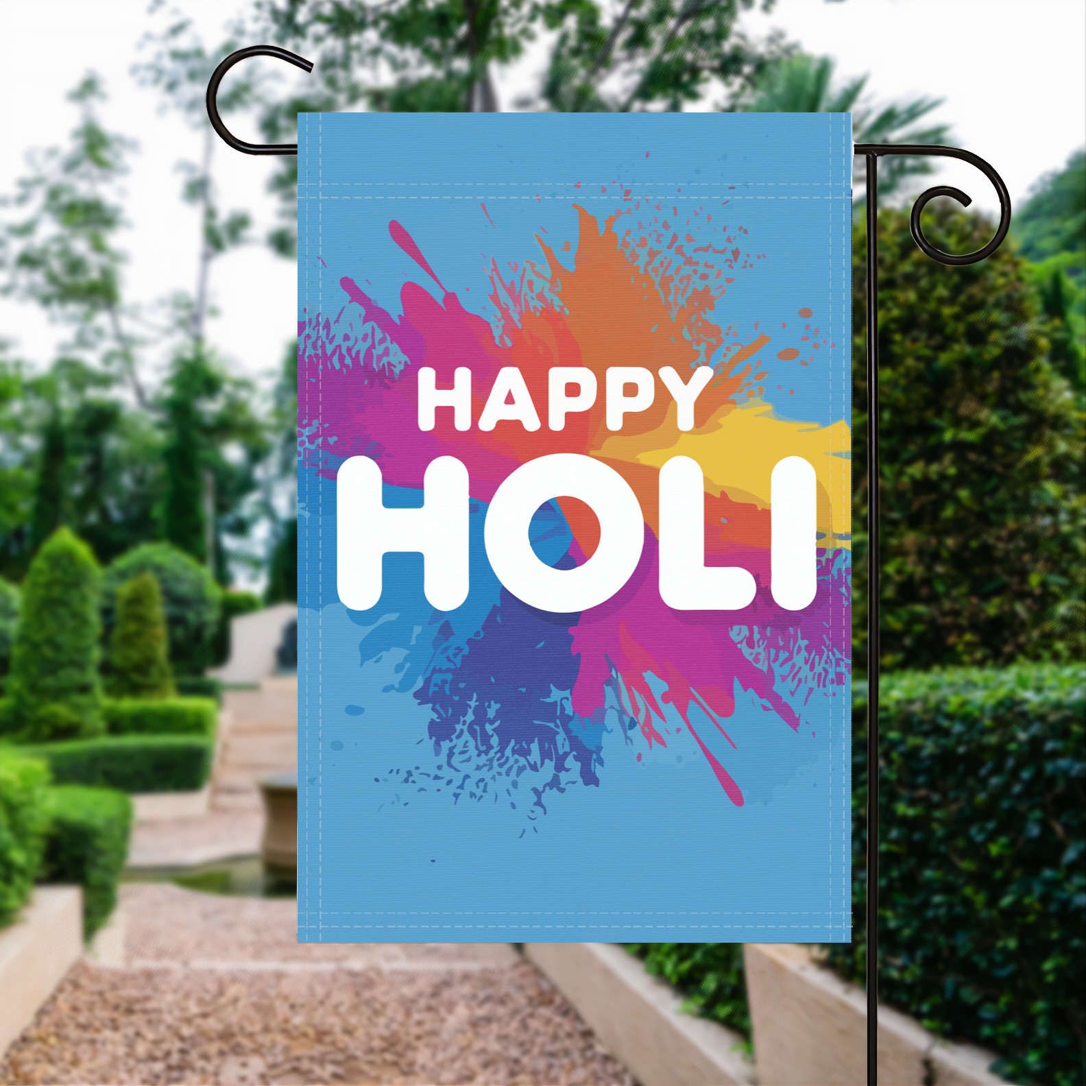 Happy Holi garden flag made of weatherproof polyester displayed in a garden | Bannerfi