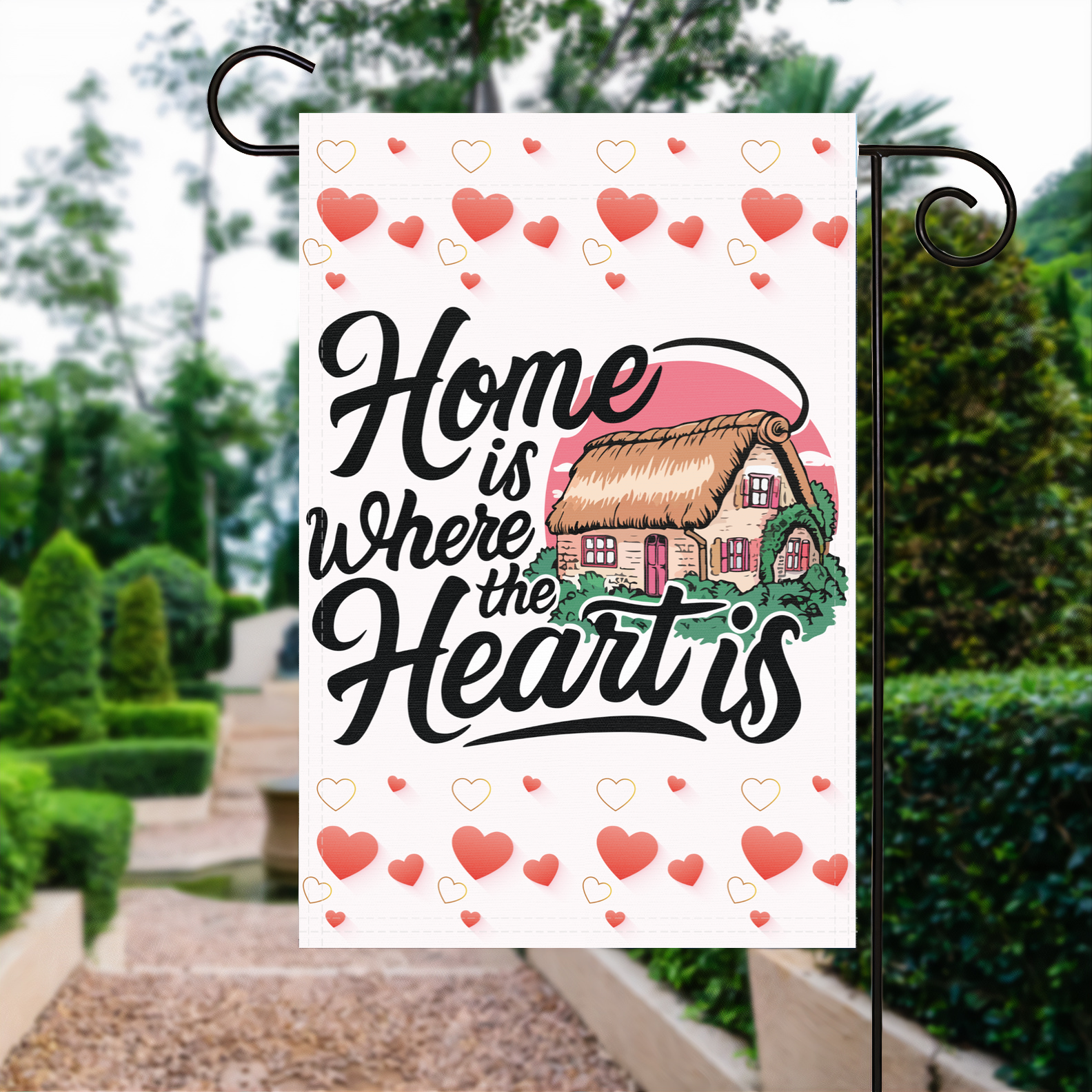 Home Is Where The Heart Is garden flag made of weatherproof polyester displayed in a garden | Bannerfi