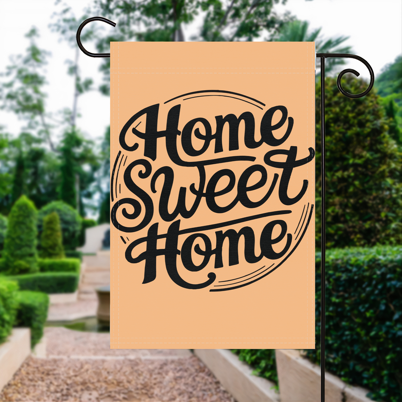 Home Sweet Home garden flag made of weatherproof polyester displayed in a garden | Bannerfi