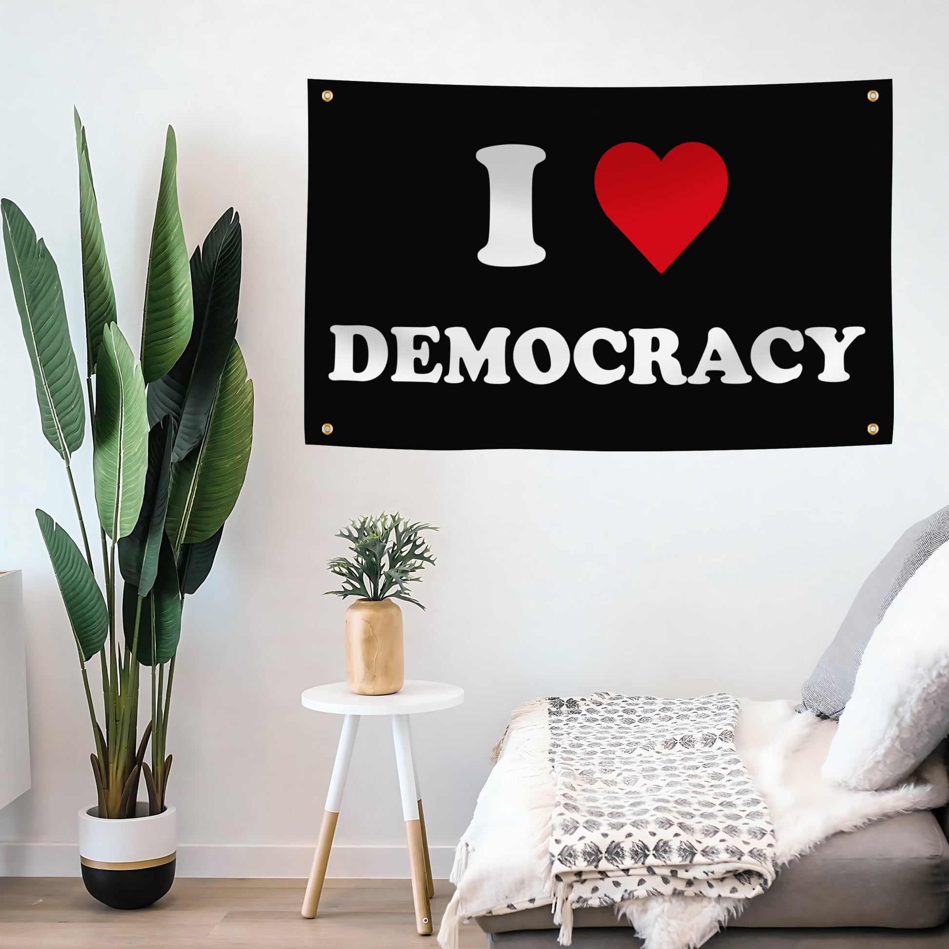 Flag with 'I ❤️ DEMOCRACY' text in a room with plants and furniture.
