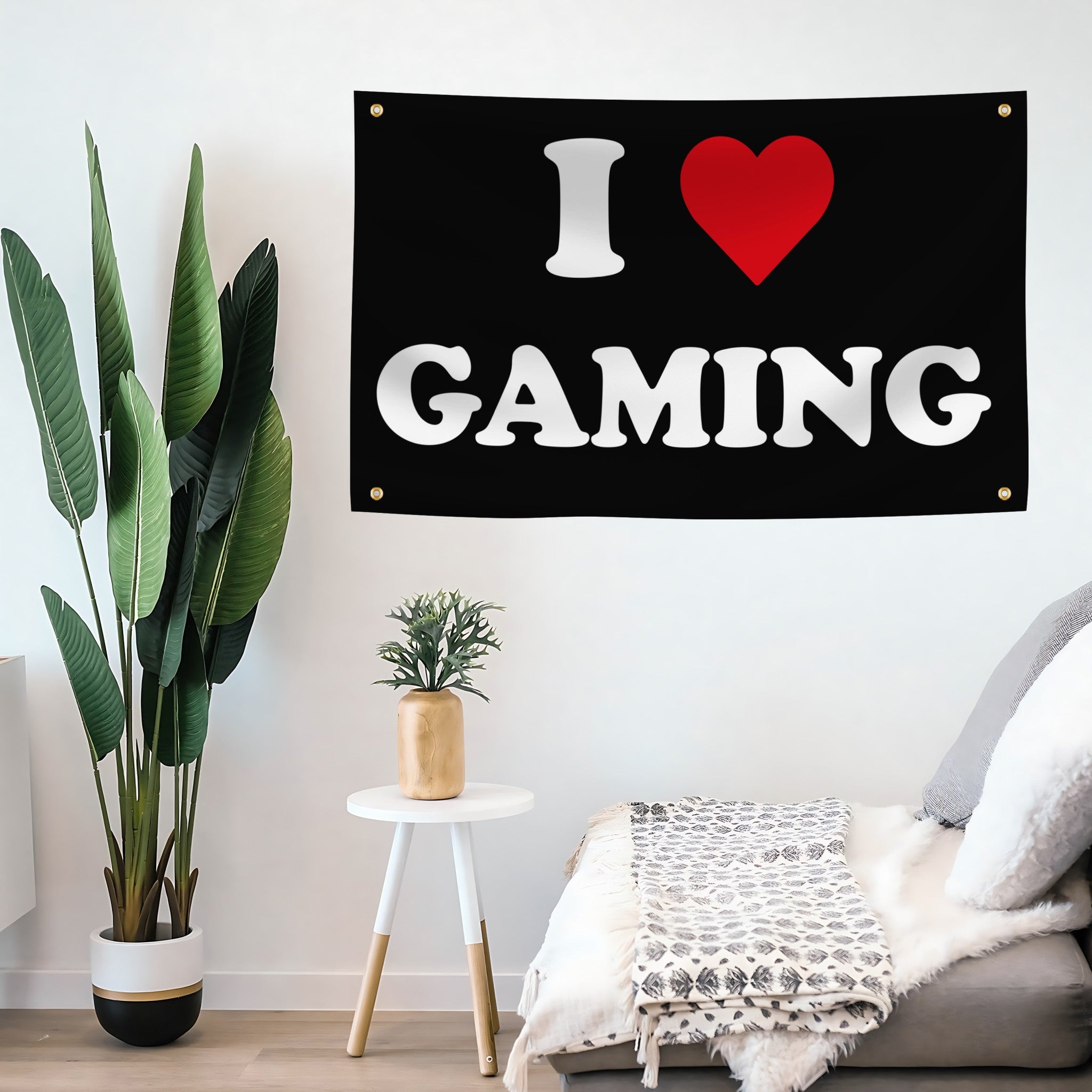 I love gaming flag banner on a wall with a plant and small table in the room.
