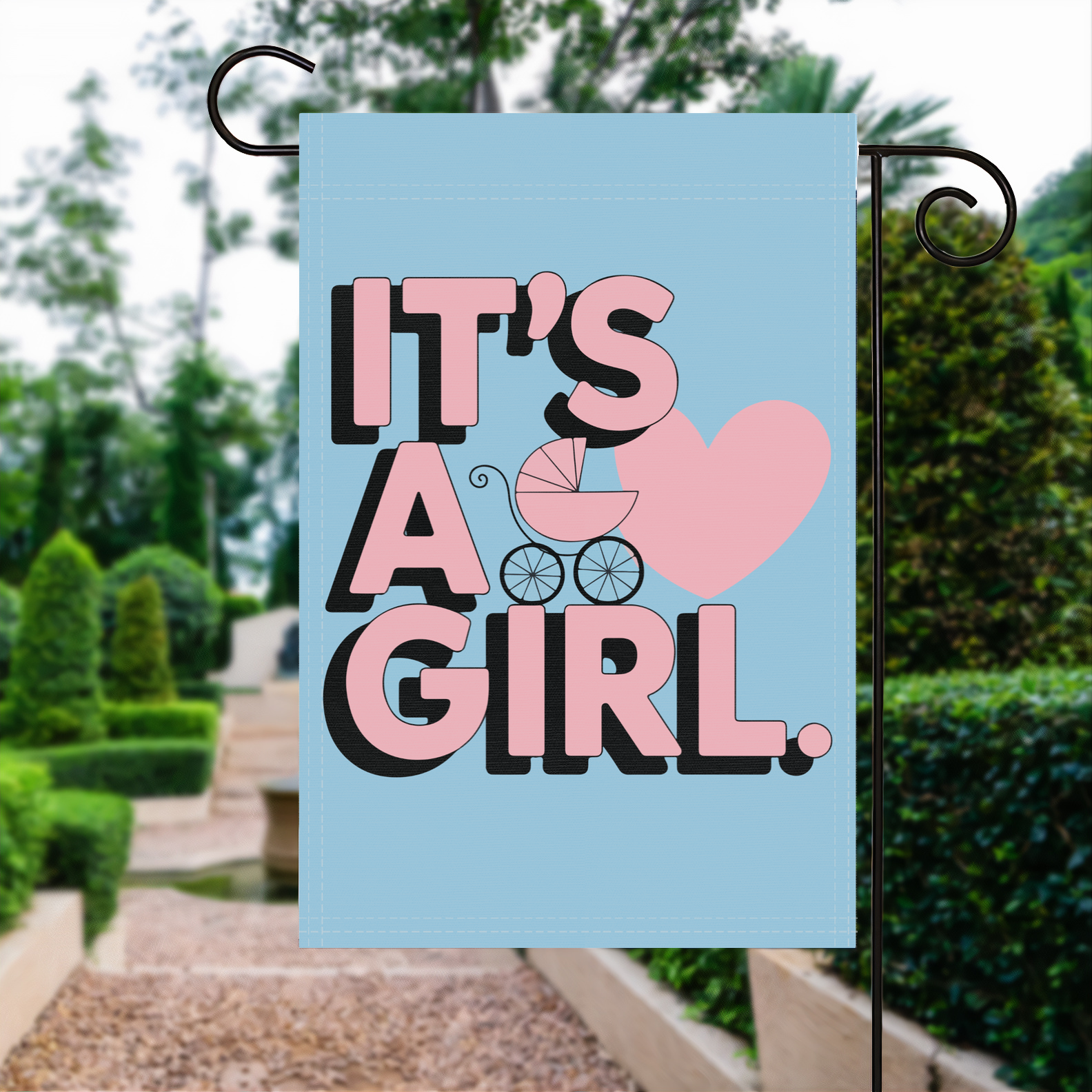 It's A Girl garden flag made of weatherproof polyester displayed in a garden | Bannerfi