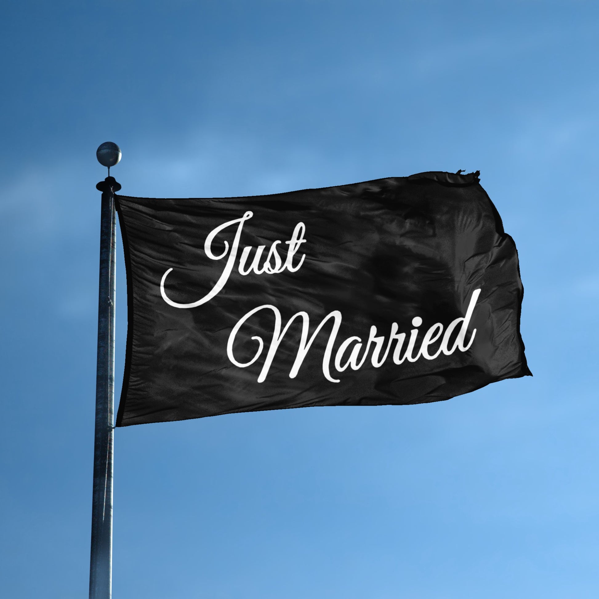 A flag with the theme "Just Married Black" displayed on a tall flag pole and blue skies.