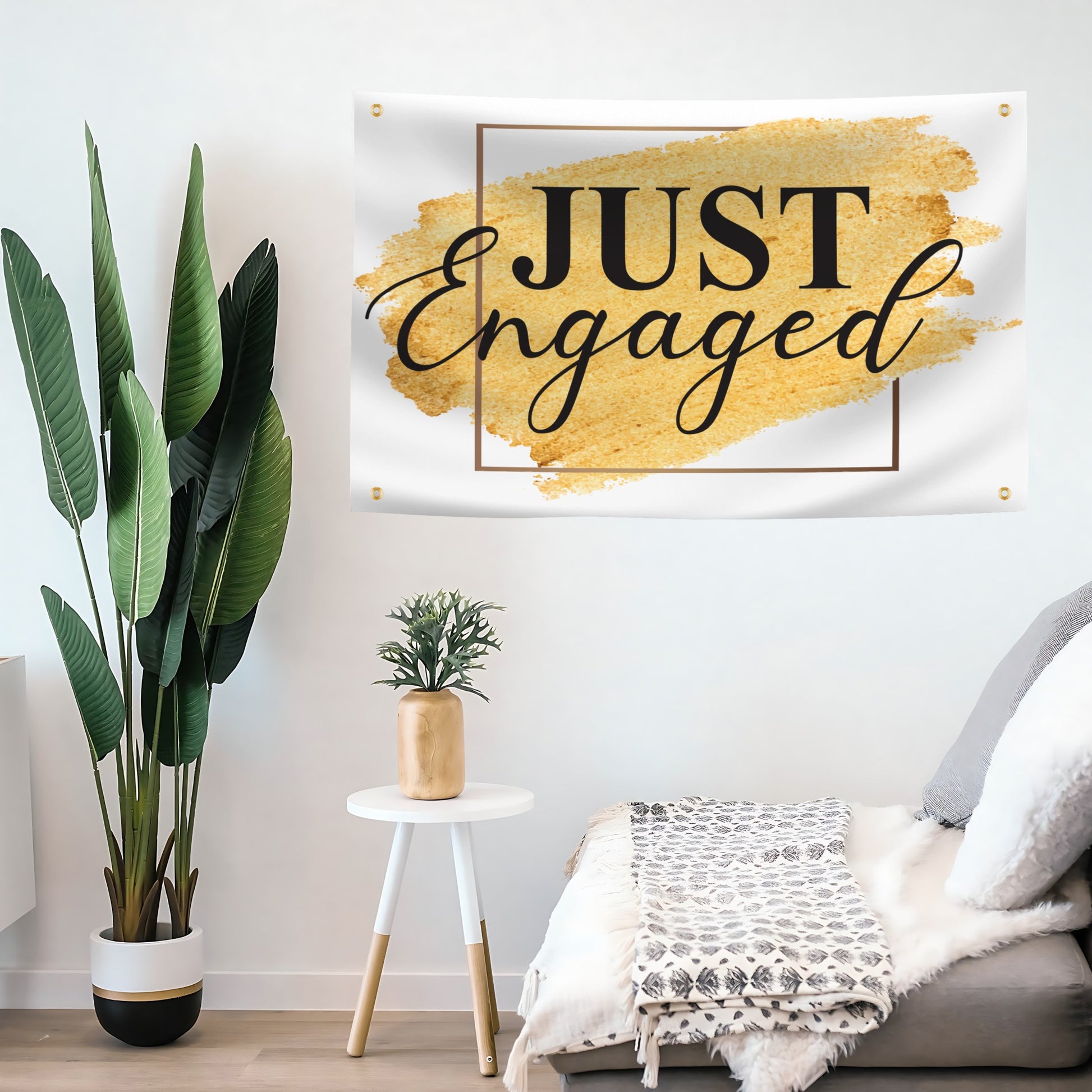 Decorative flag banner with 'JUST Engaged' text in a living room setting.