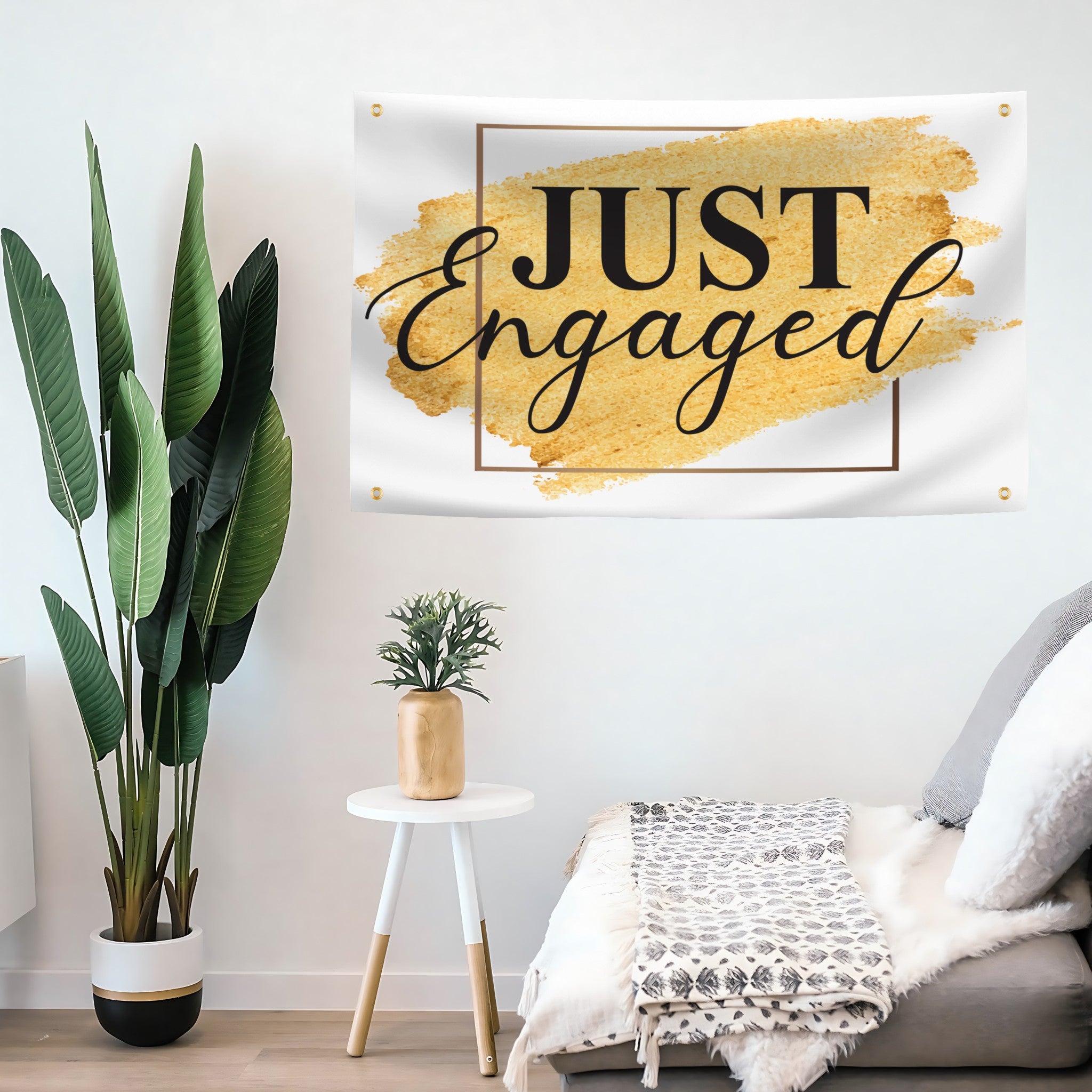Decorative flag banner with 'JUST Engaged' text in a living room setting.