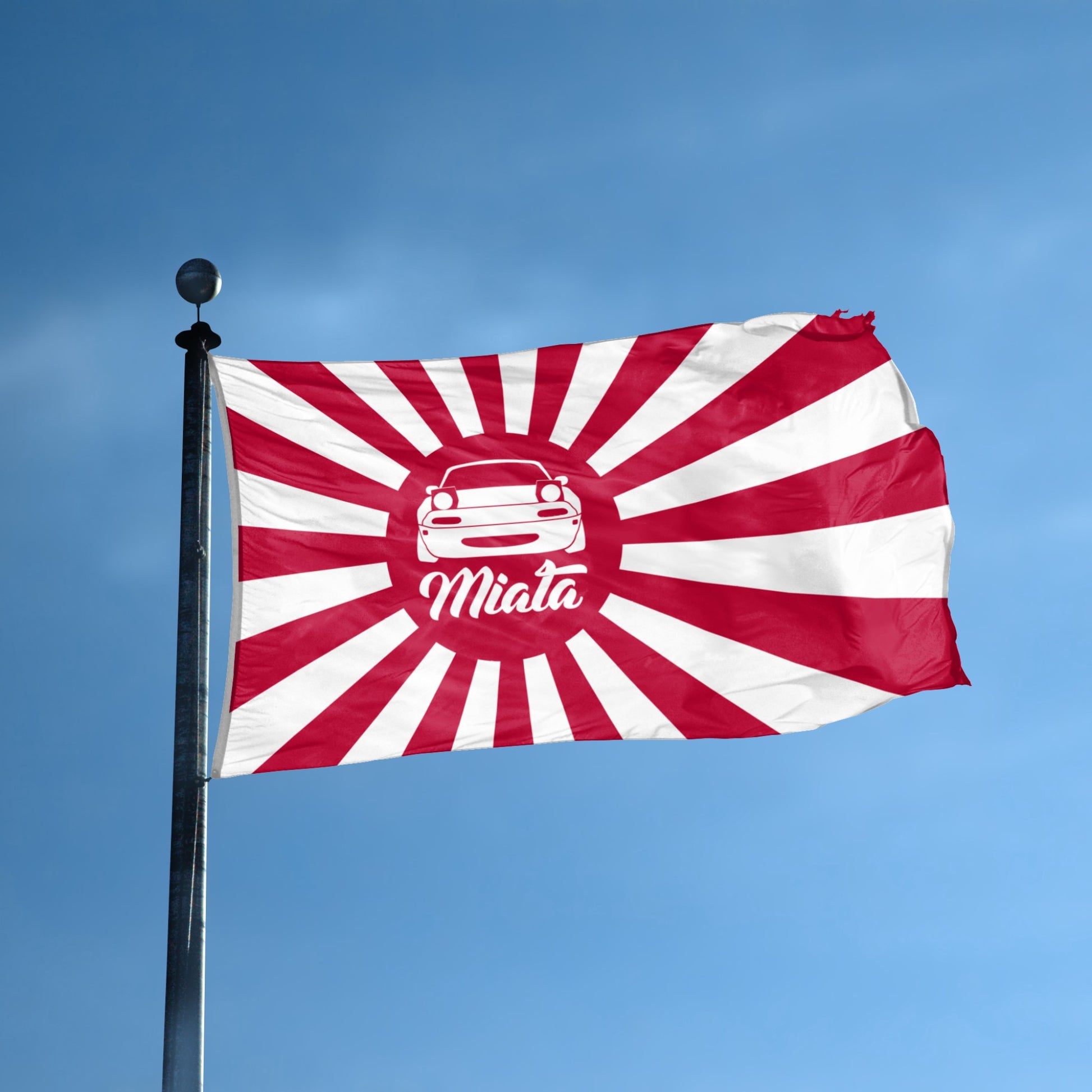 Flag with a red and white sunburst design featuring an NA Miata silhouette and 'Miata' text flying on a flagpole.