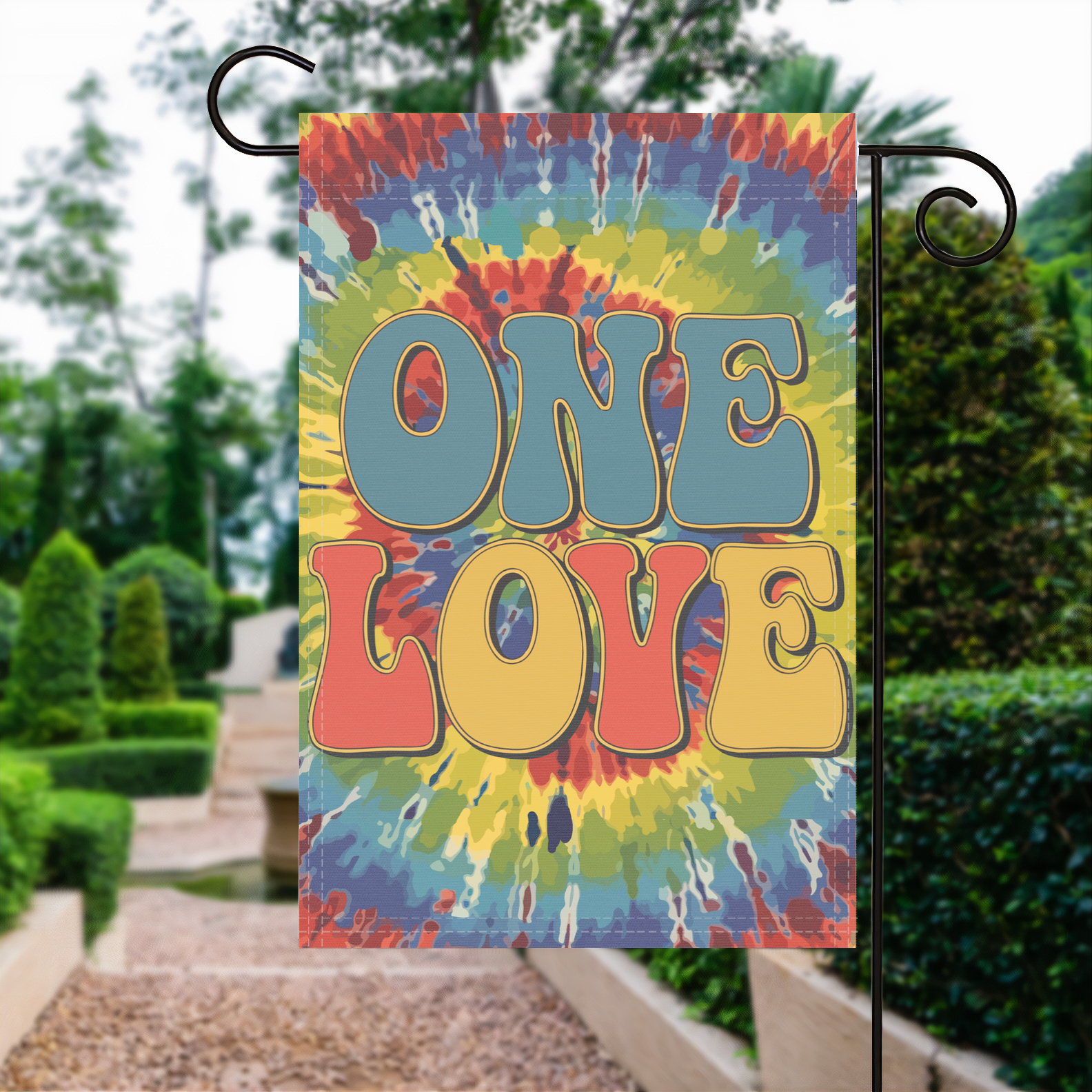 One Love garden flag made of weatherproof polyester displayed in a garden | Bannerfi