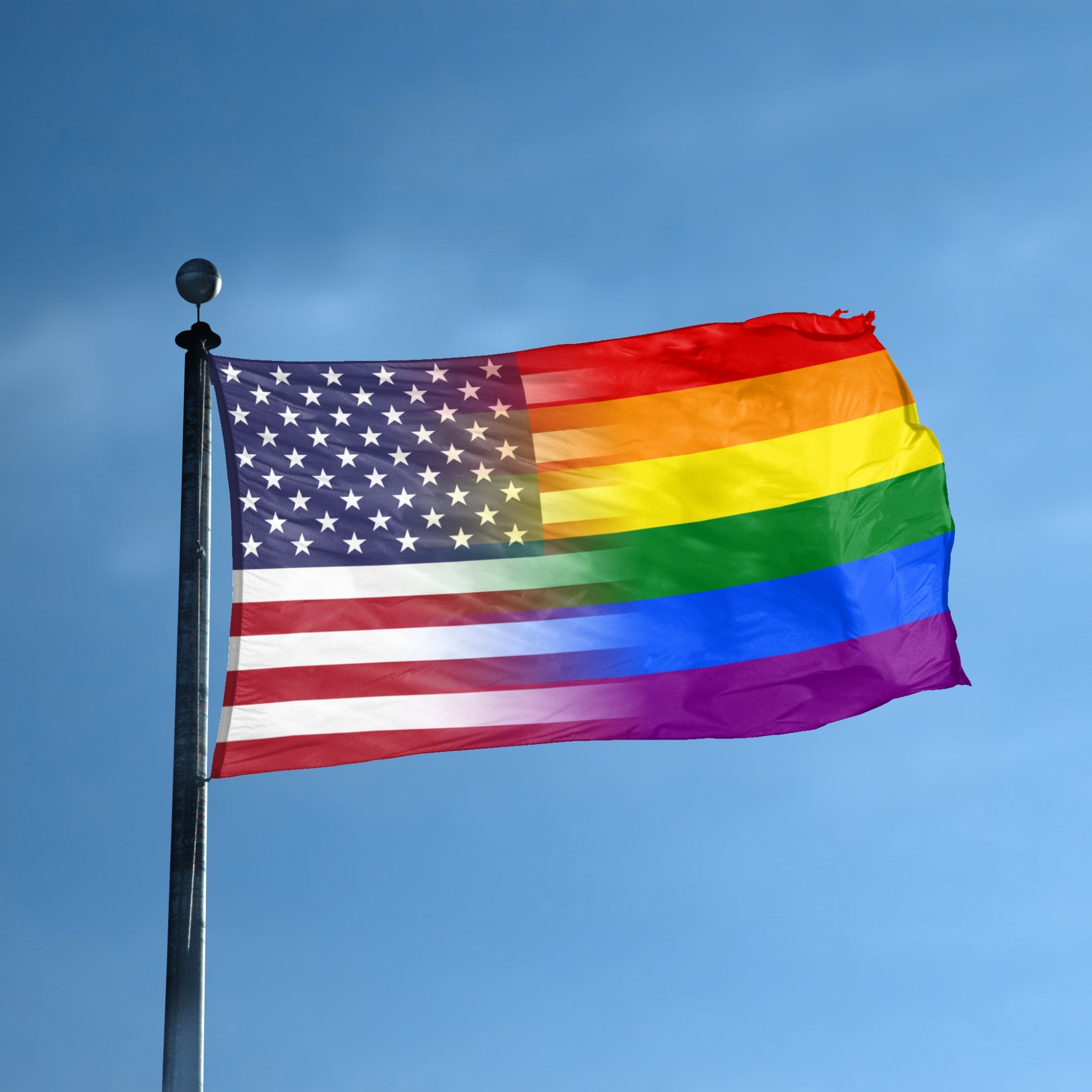 A flag with the theme "Pride & American Blended" displayed on a tall flag pole and blue skies.