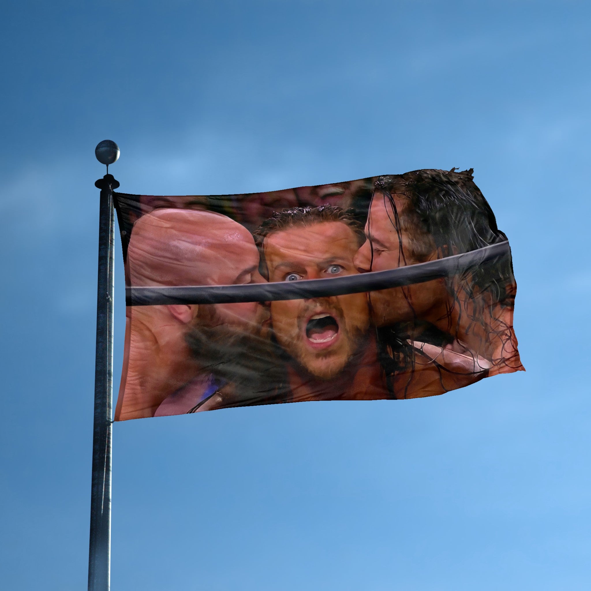 A flag with the theme "Ringside Surprise Kiss Meme" displayed on a tall flag pole and blue skies.