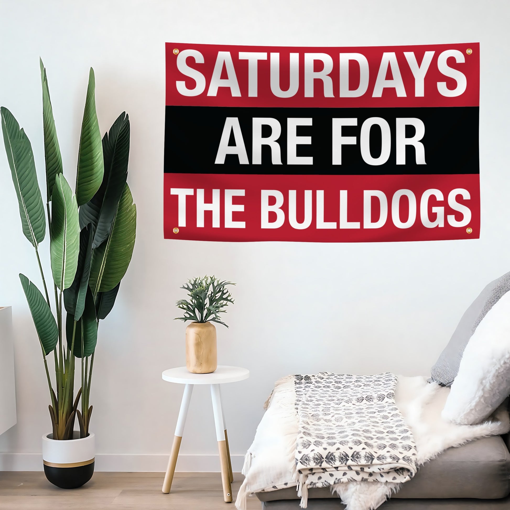 Decorative flag banner with 'Saturdays are for the Bulldogs' text in a living room setting.
