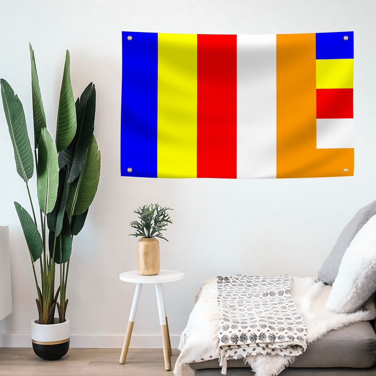 A Buddhism flag banner with vertical blue, yellow, red, and white stripes mounted on a wall.