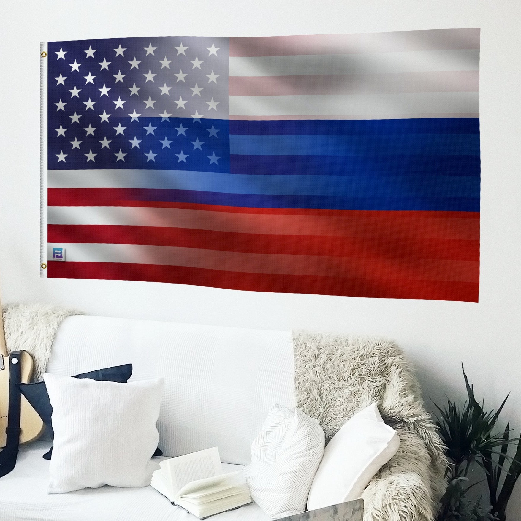 American and Russian flag hybrid on a wall above a white couch with decorative pillows and a guitar.