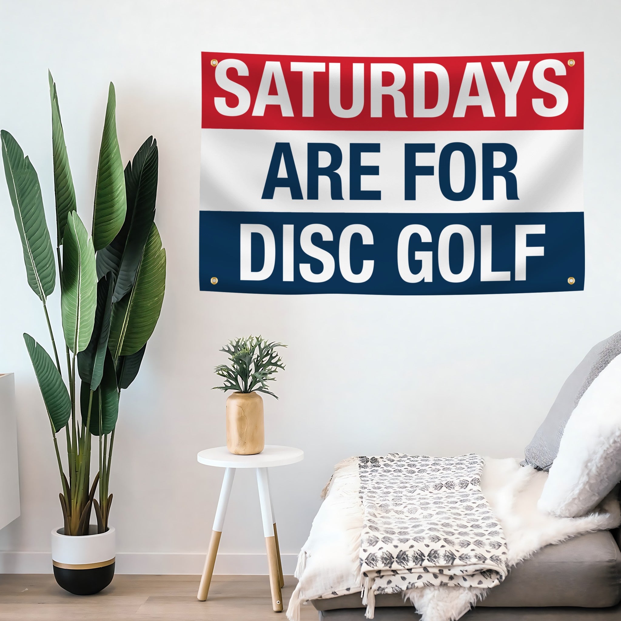 Decorative flag banner with 'Saturdays are for Disc Golf' text in a living room setting.