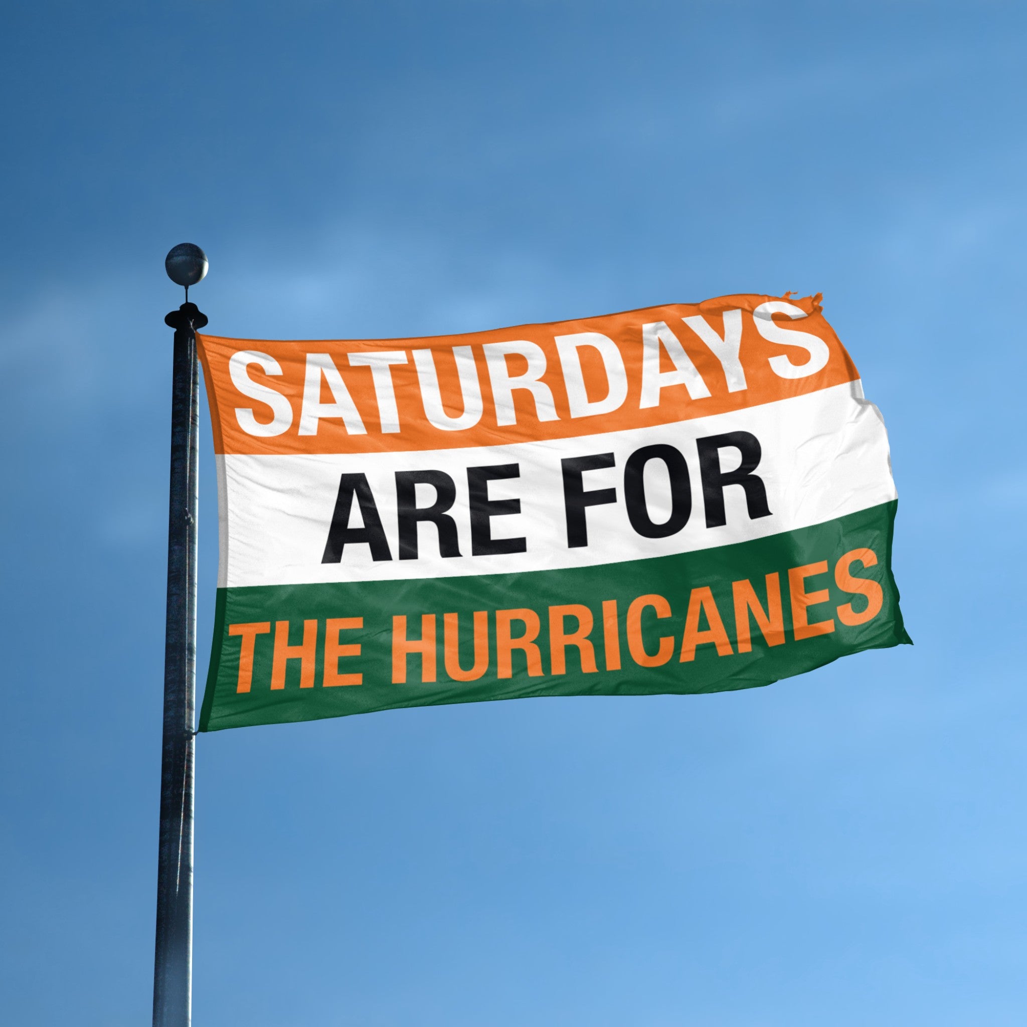 Flag with text 'Saturdays are for the Hurricanes' against a blue sky