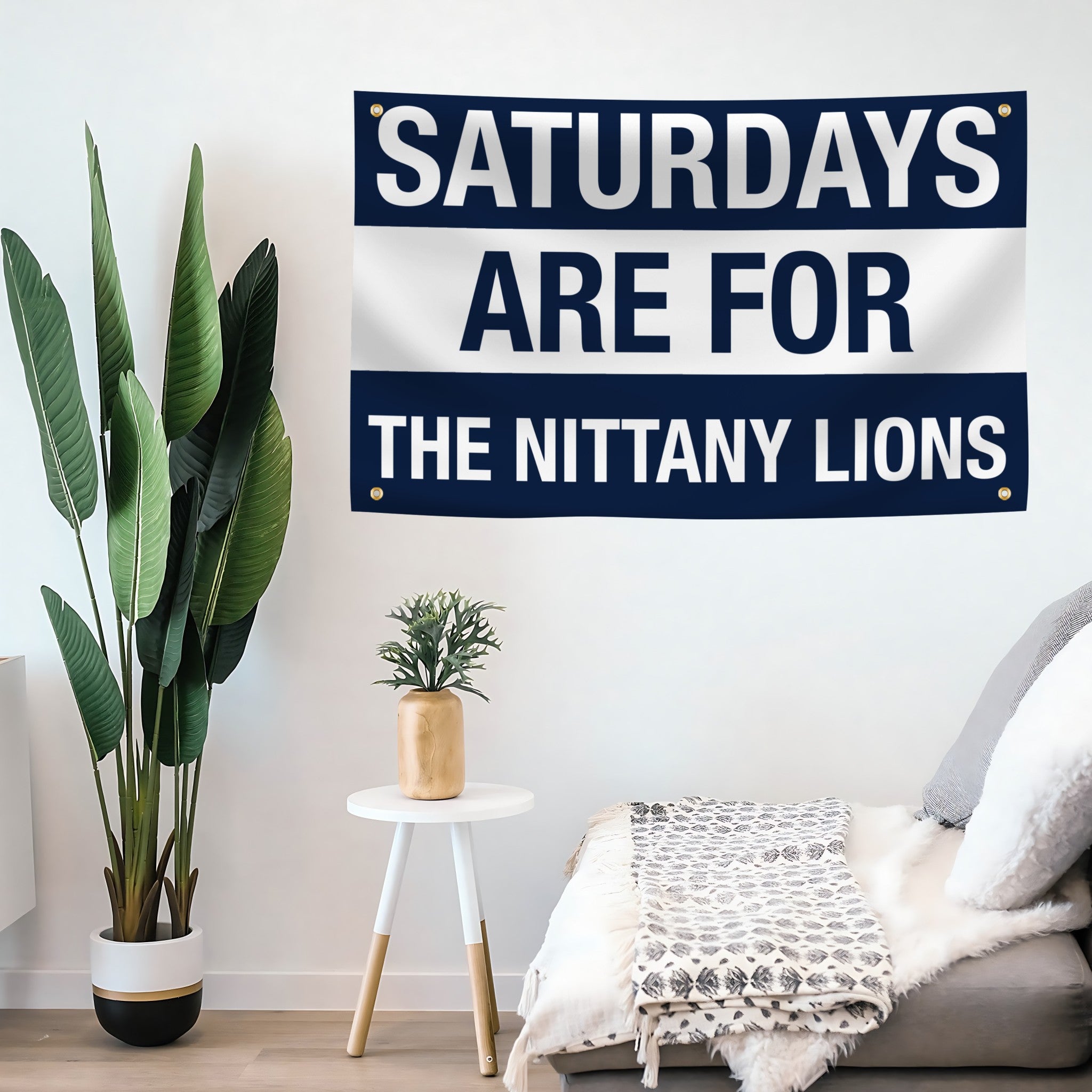 Decorative flag banner with 'Saturdays are for the Nittany Lions' text in a living room setting.
