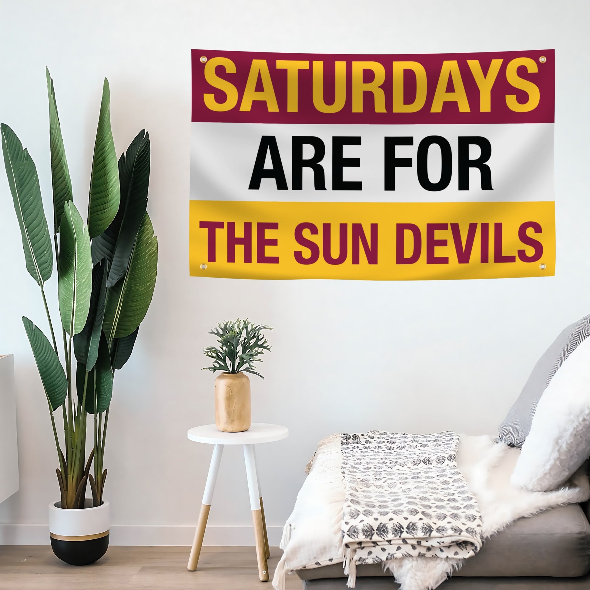 Decorative flag banner with 'Saturdays are for the Sun Devils' text in a living room setting.