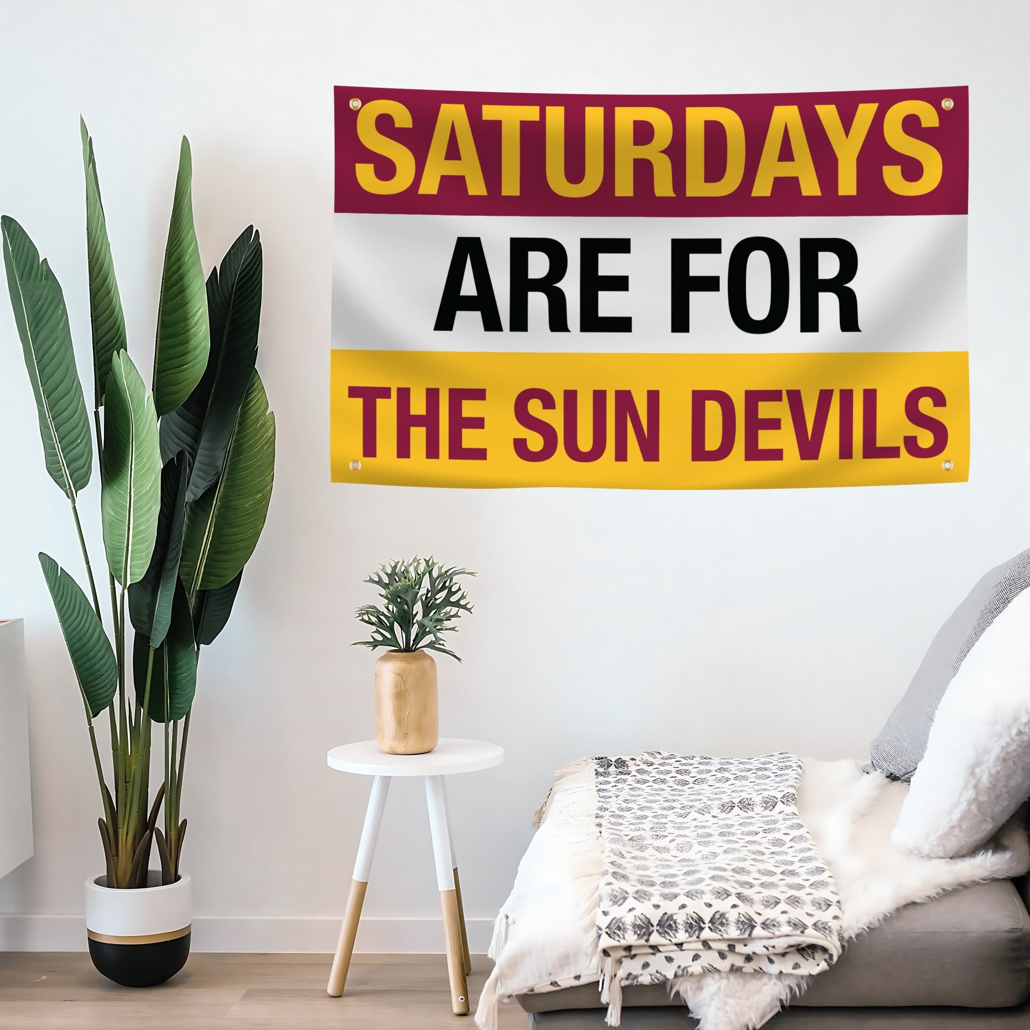 Decorative flag banner with 'Saturdays are for the Sun Devils' text in a living room setting.