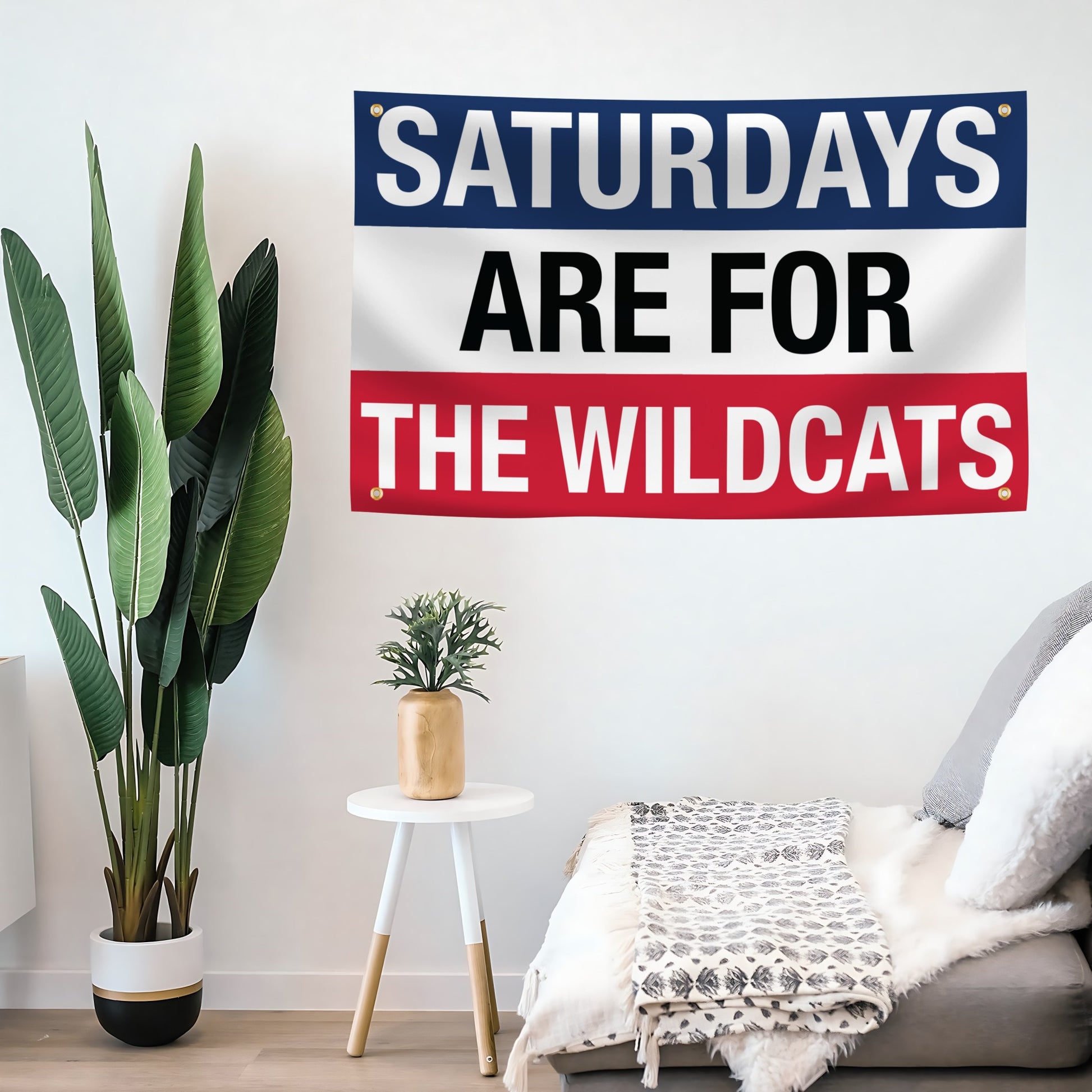 Decorative flag banner with 'Saturdays are for the Wildcats' text in a living room setting.