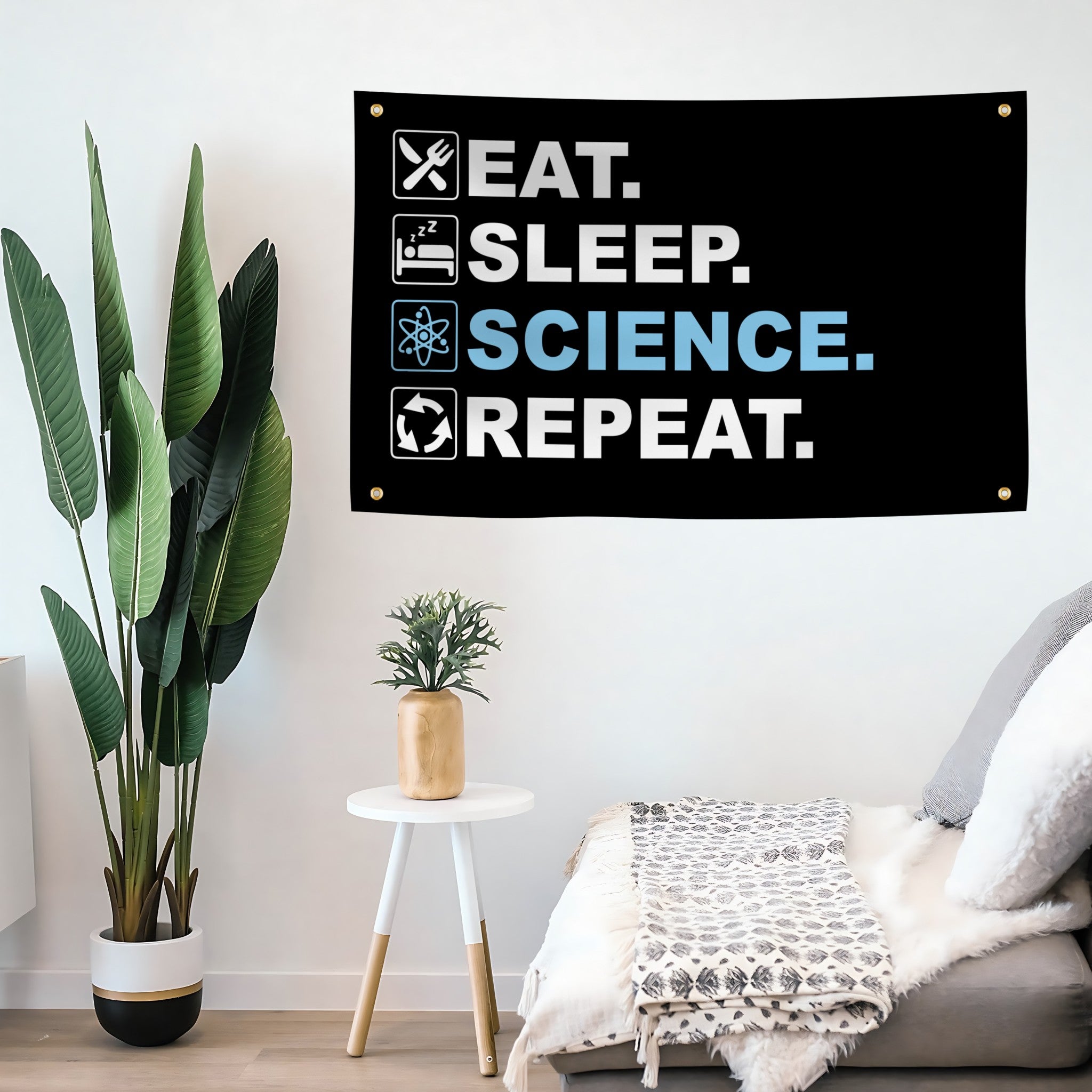 Decorative flag banner with 'Eat. Sleep. Science. Repeat.' text in a modern living room.