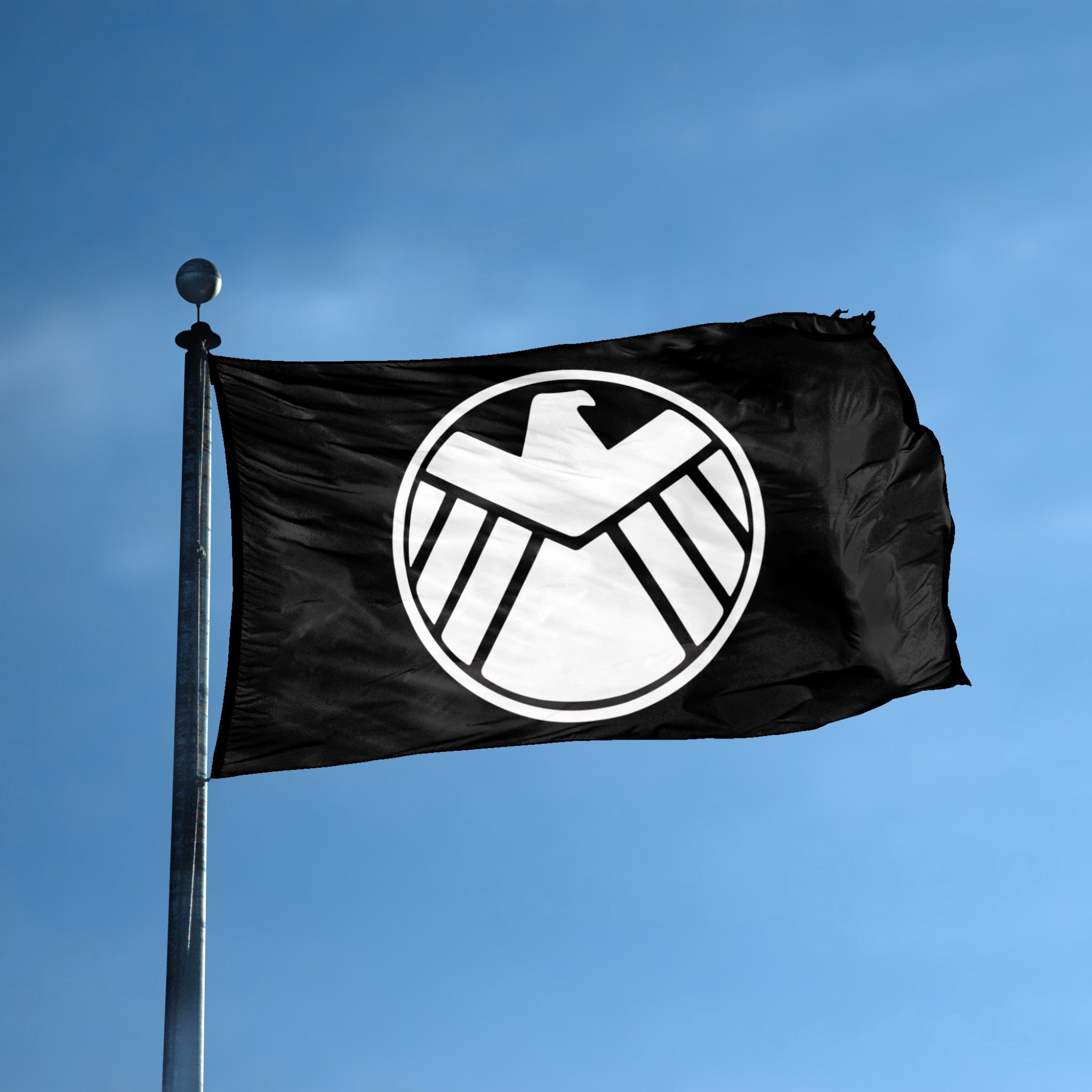 A flag with the theme "Agents of SHIELD Crest" displayed on a tall flag pole and blue skies.