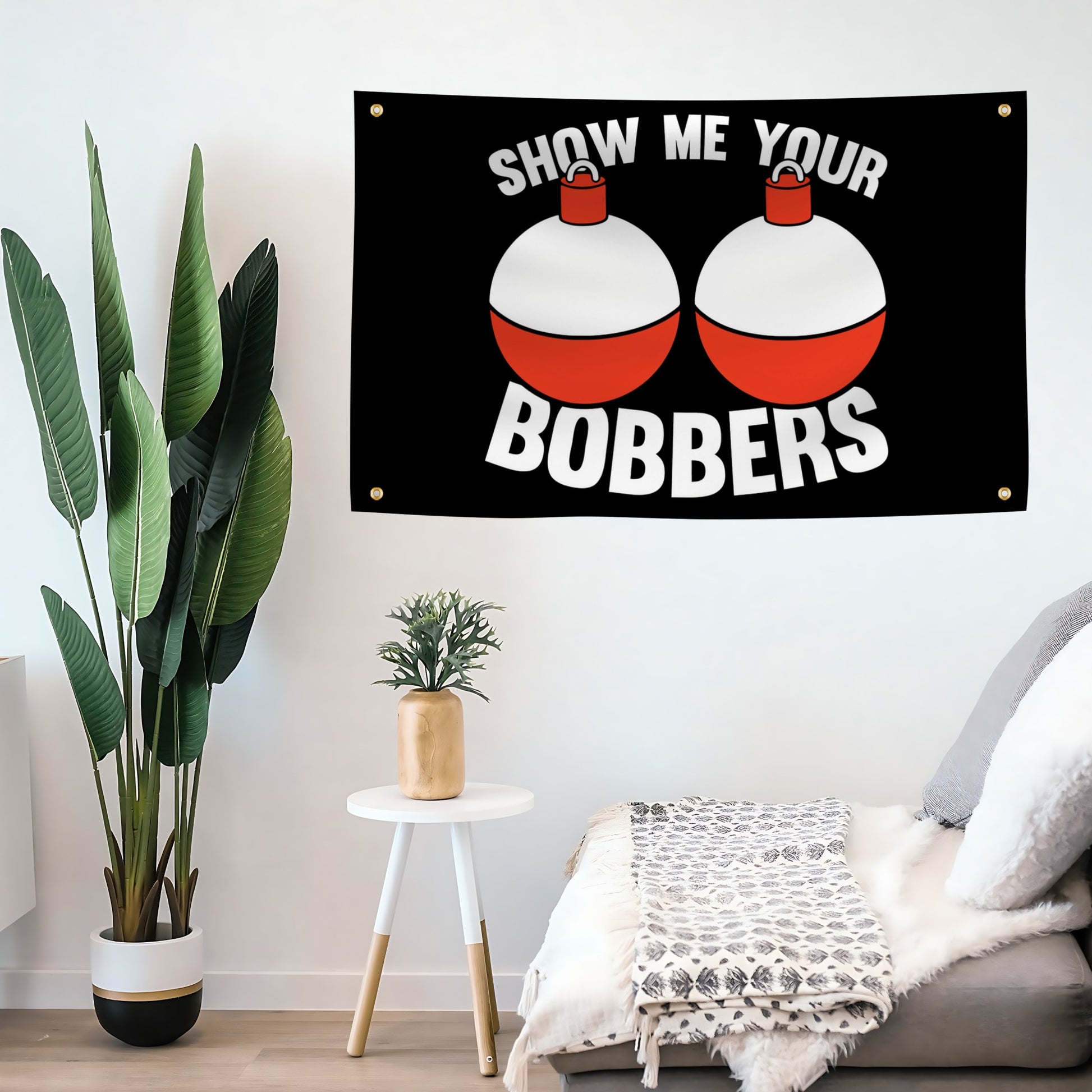 Flag banner with 'Show Me Your Bobbers' text and bobber graphics on a living room wall.