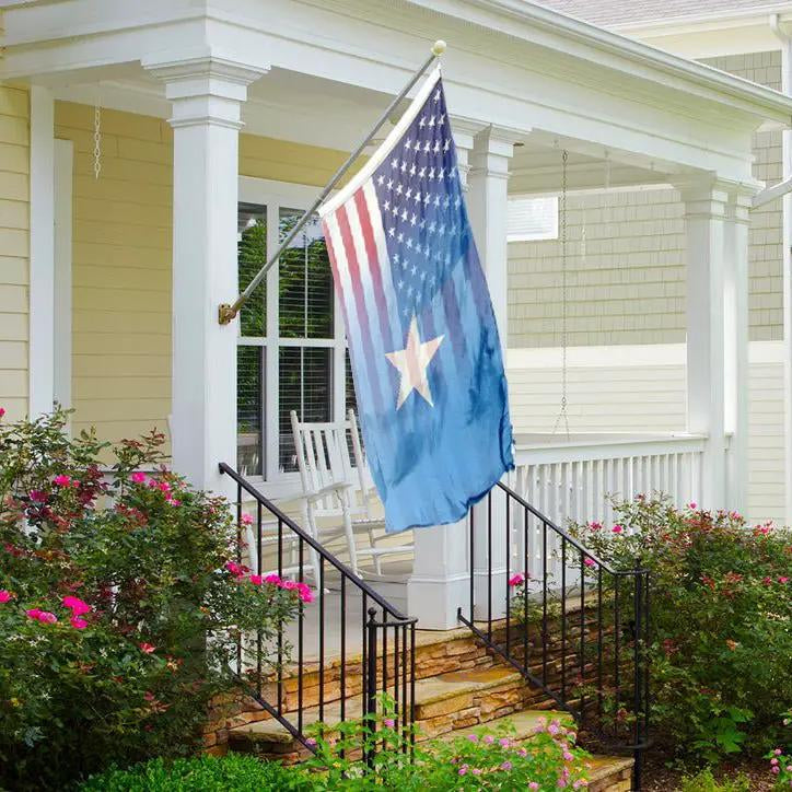 House flag Somalian American Hybrid Flag on a front porch pole, blue field with white star.