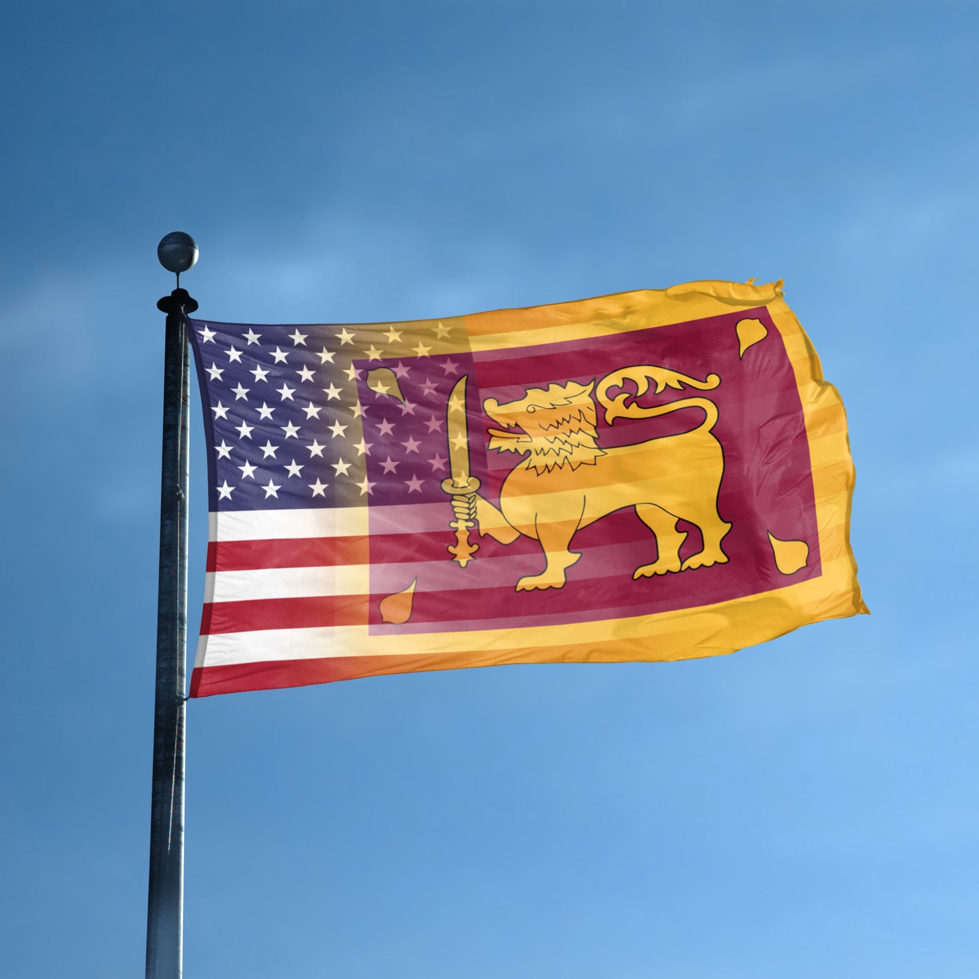 Flag with American and Sri Lankan designs blended together on a flagpole against a blue sky.