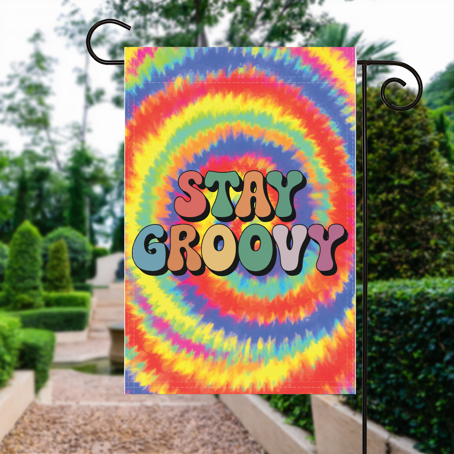 Stay Groovy garden flag made of weatherproof polyester displayed in a garden | Bannerfi