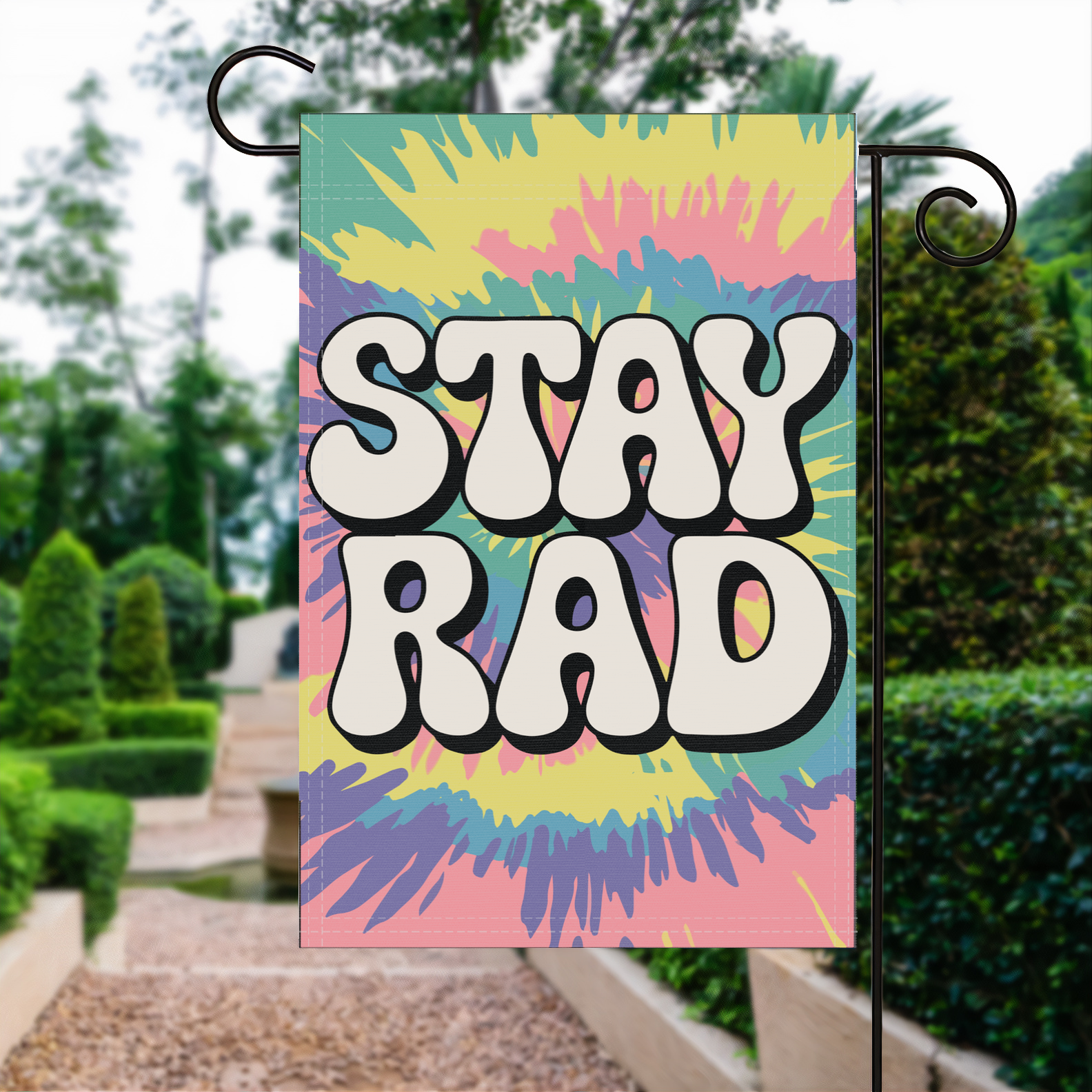 Stay Rad garden flag made of weatherproof polyester displayed in a garden | Bannerfi