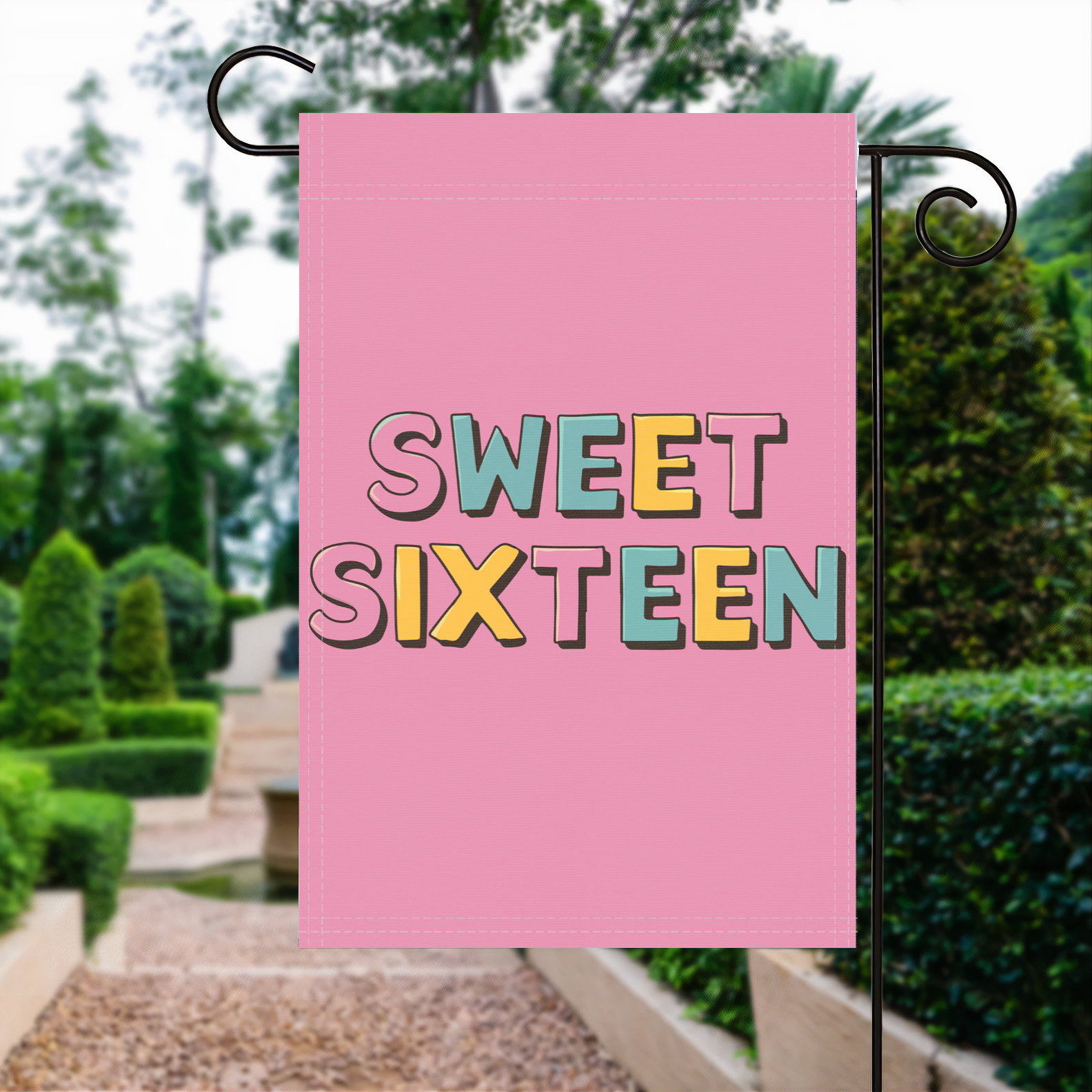Sweet Sixteen garden flag made of weatherproof polyester displayed in a garden | Bannerfi