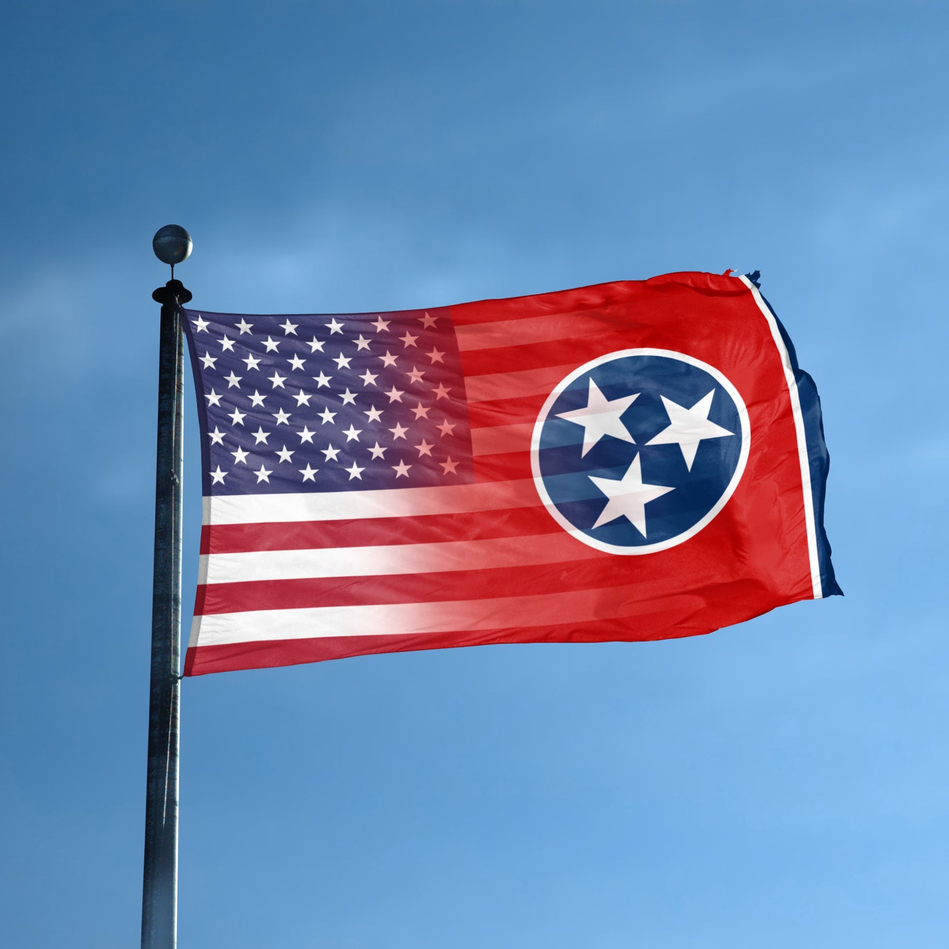 Flag of Tennessee blended with the American flag on a flagpole against a clear blue sky.