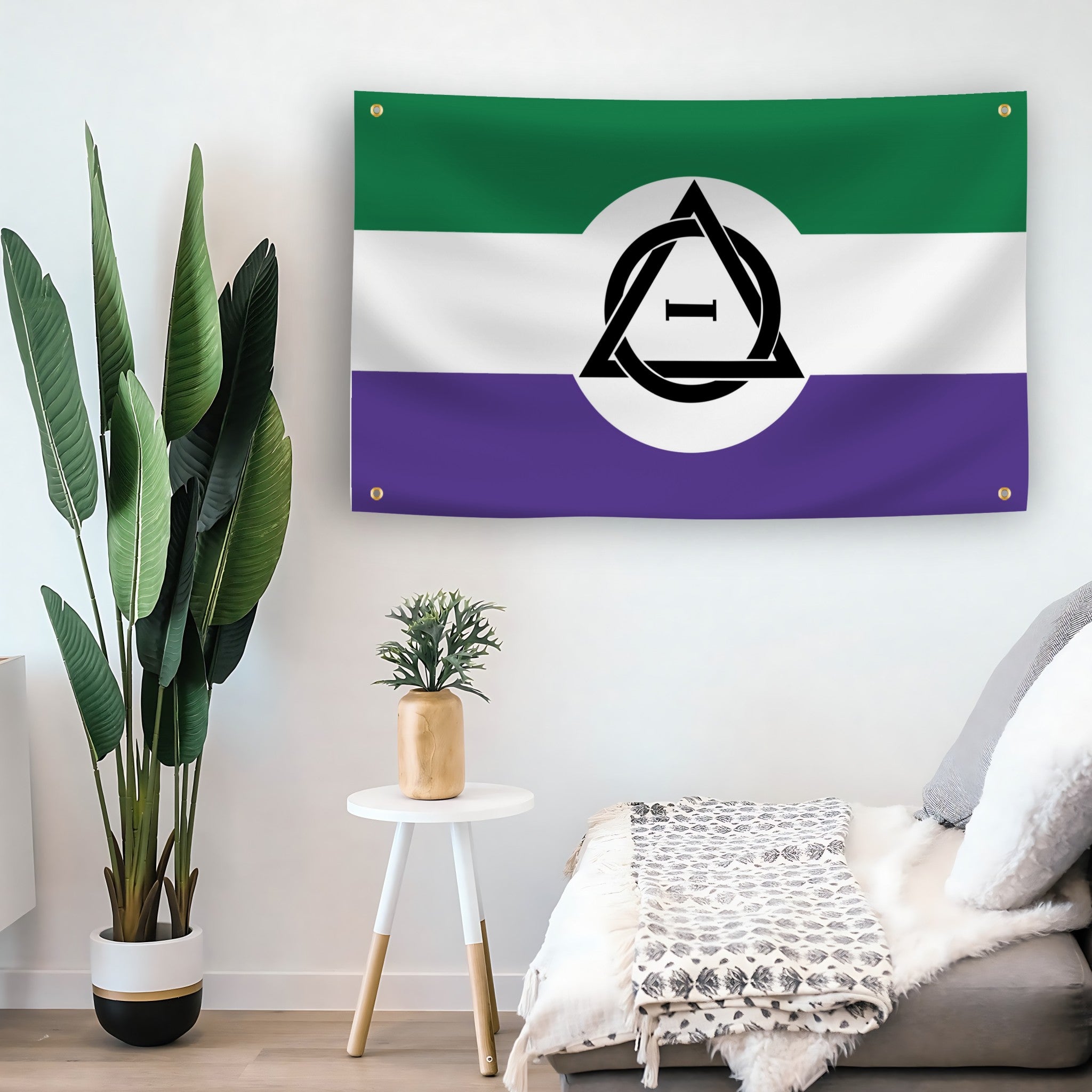 4 grommet unity flag with green, white, and purple horizontal stripes and a black therian symbol in the center symbolizing non-human identity on a wall.