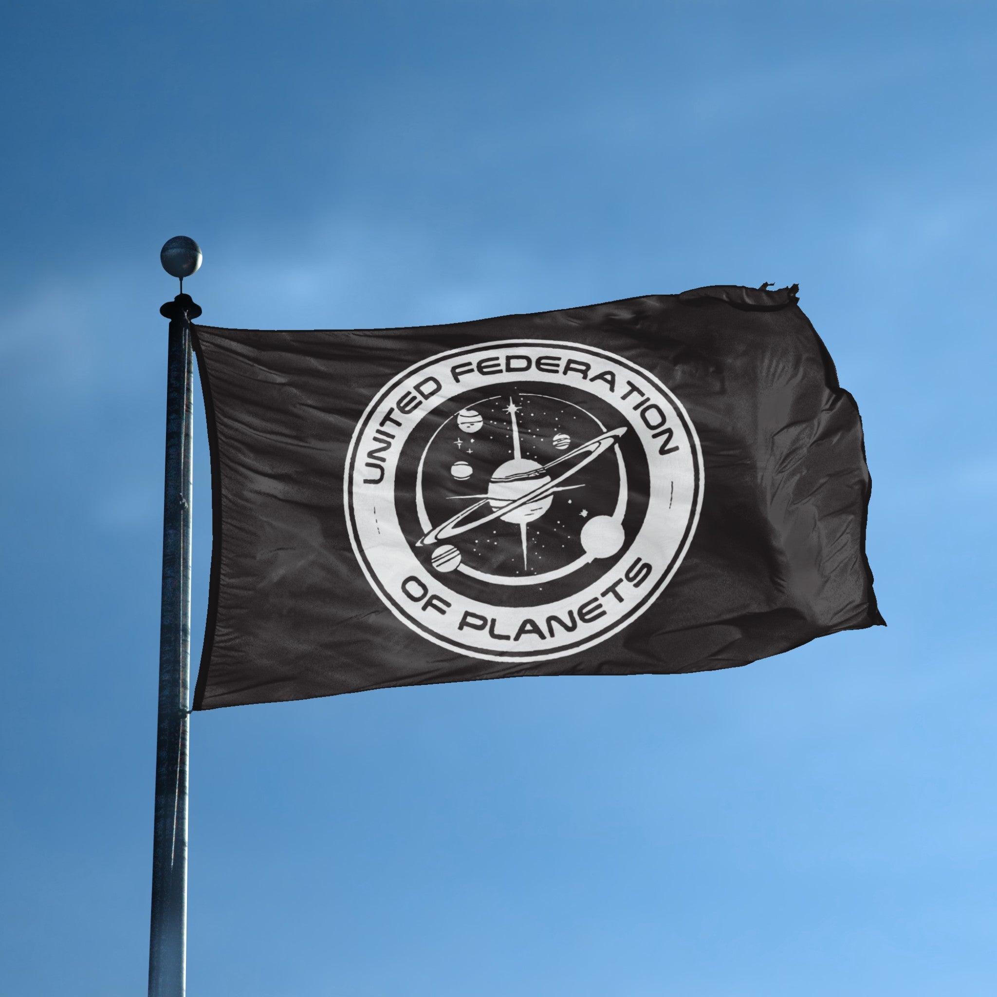 A flag with the theme "Star Trek UFOP Vintage Style" displayed on a tall flag pole and blue skies.