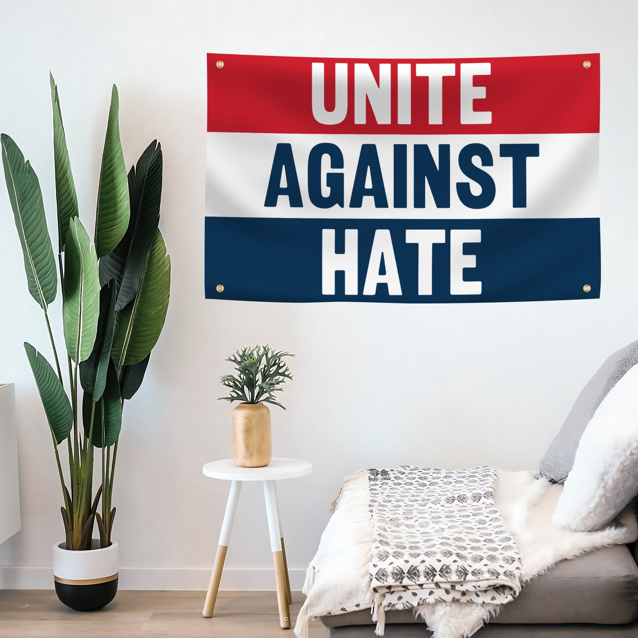 Flag banner reading 'Unite Against Hate' in a room with plants and furniture.