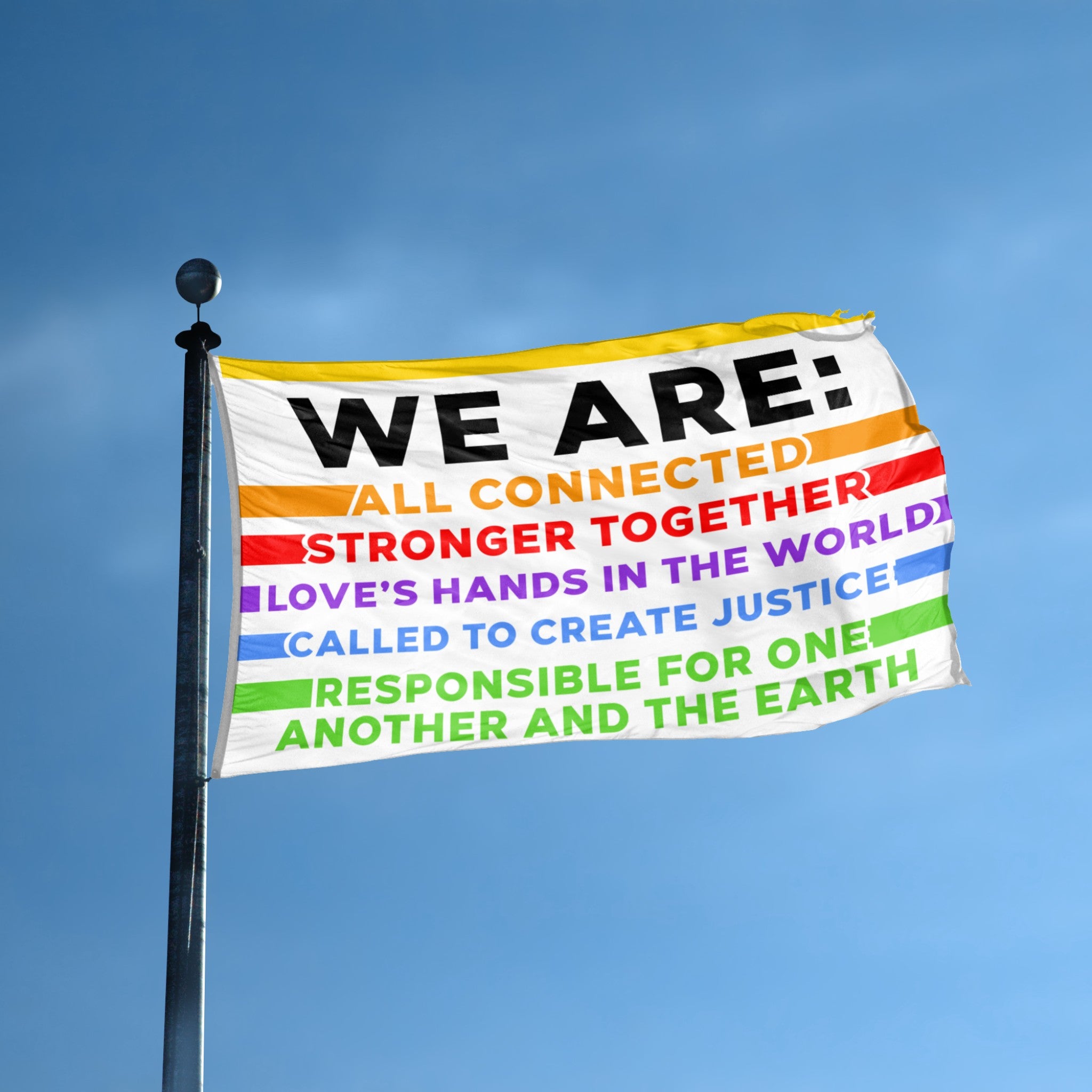 Flag with "WE ARE" and colorful motivational text against a blue sky.