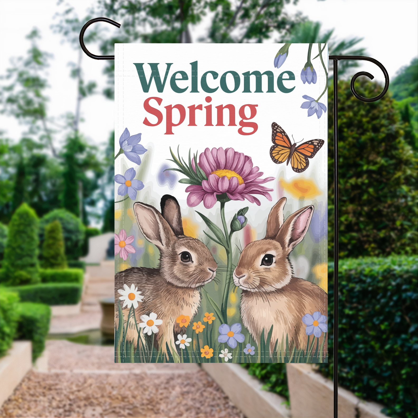Welcome Spring Bunny garden flag made of weatherproof polyester displayed in a garden | Bannerfi