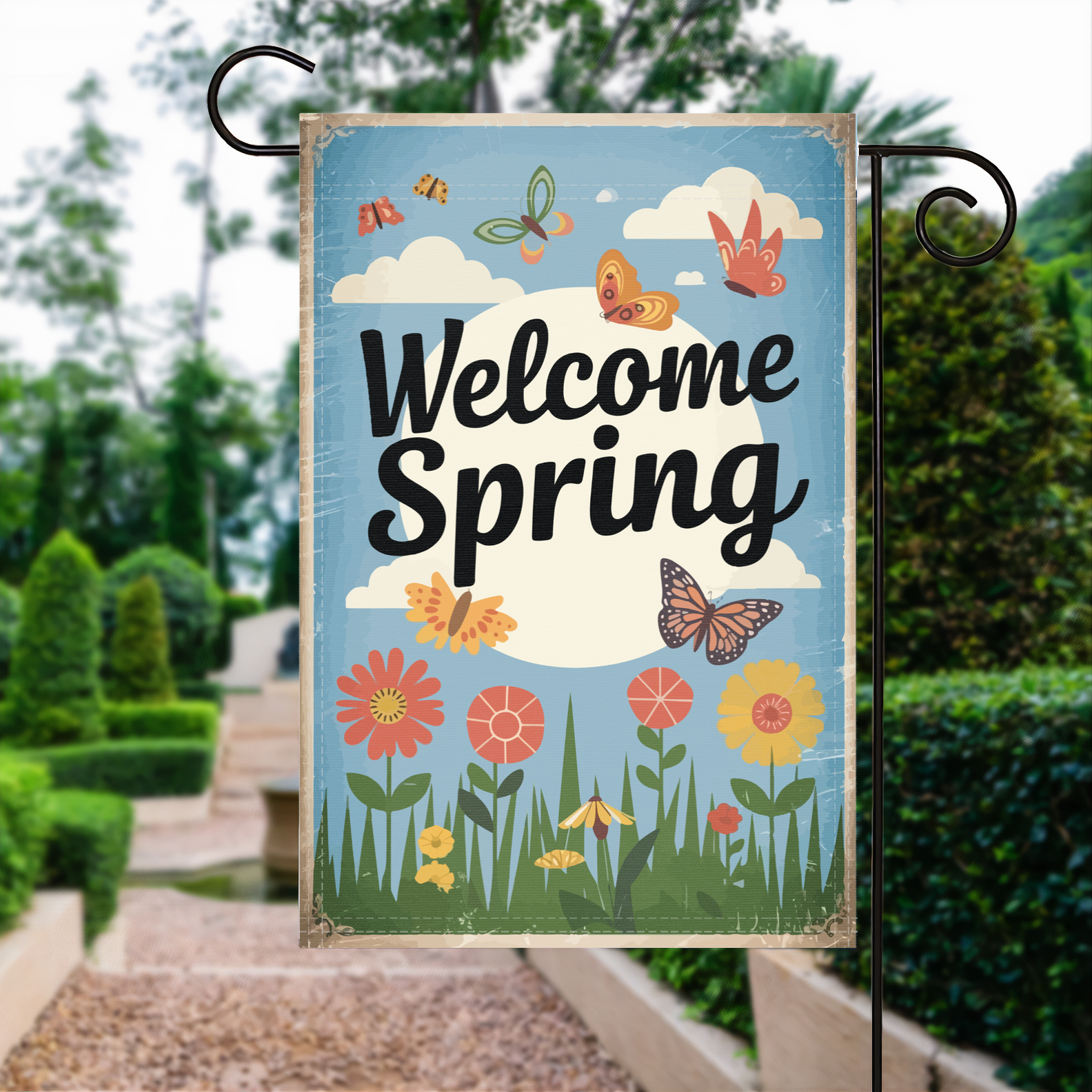 Welcome Spring Butterfly garden flag made of weatherproof polyester displayed in a garden | Bannerfi