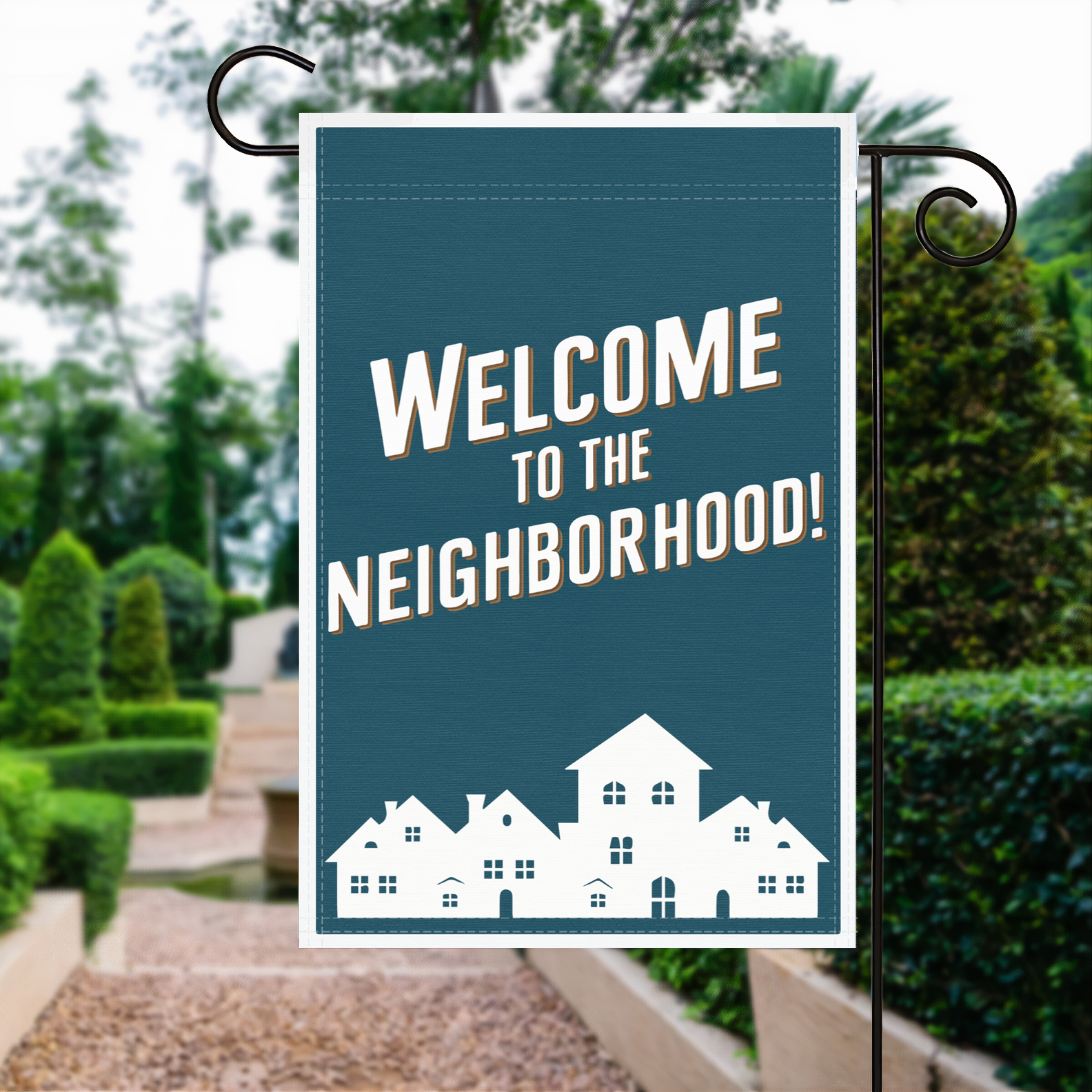 Welcome To The Neighborhood garden flag made of weatherproof polyester displayed in a garden | Bannerfi
