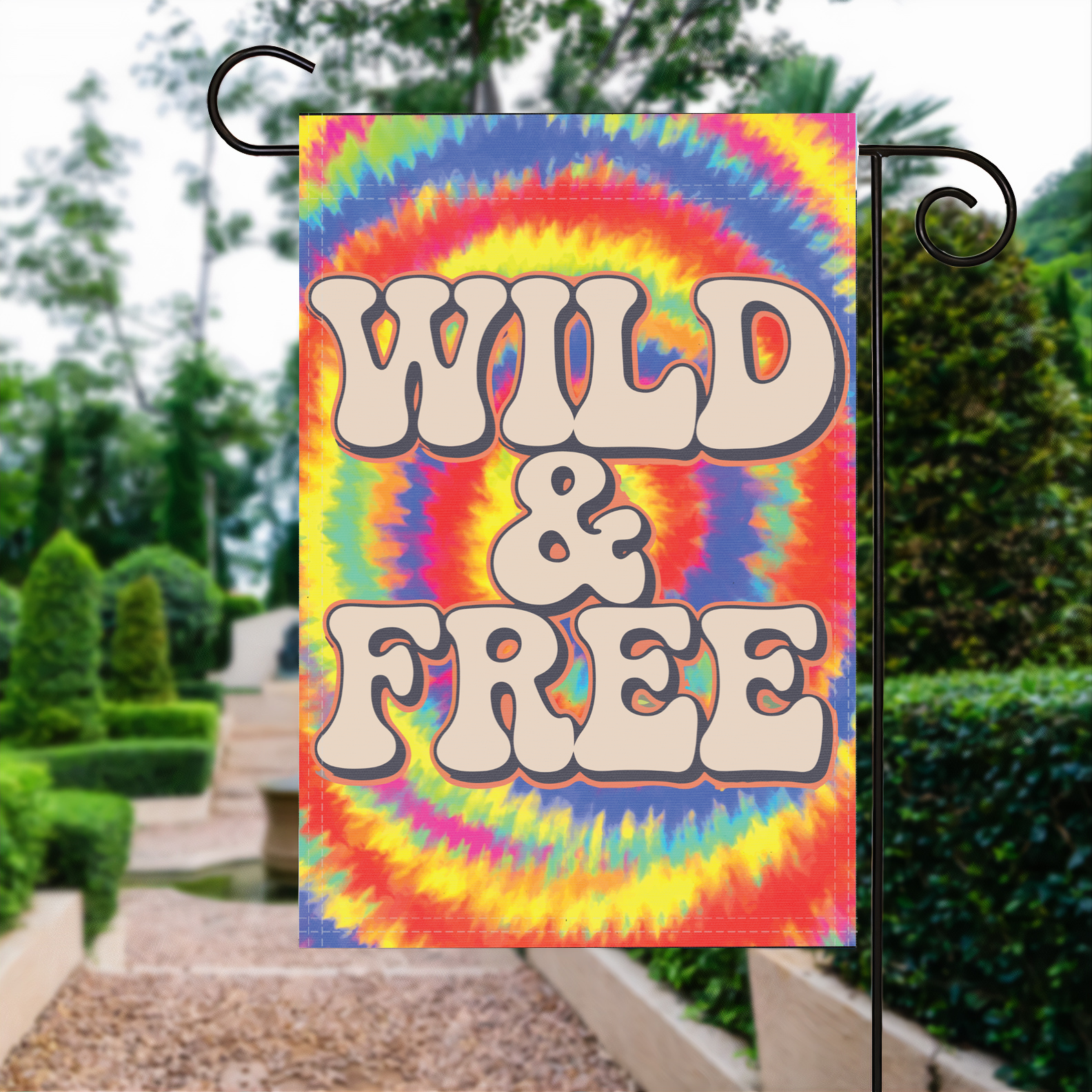 Wild And Free garden flag made of weatherproof polyester displayed in a garden | Bannerfi