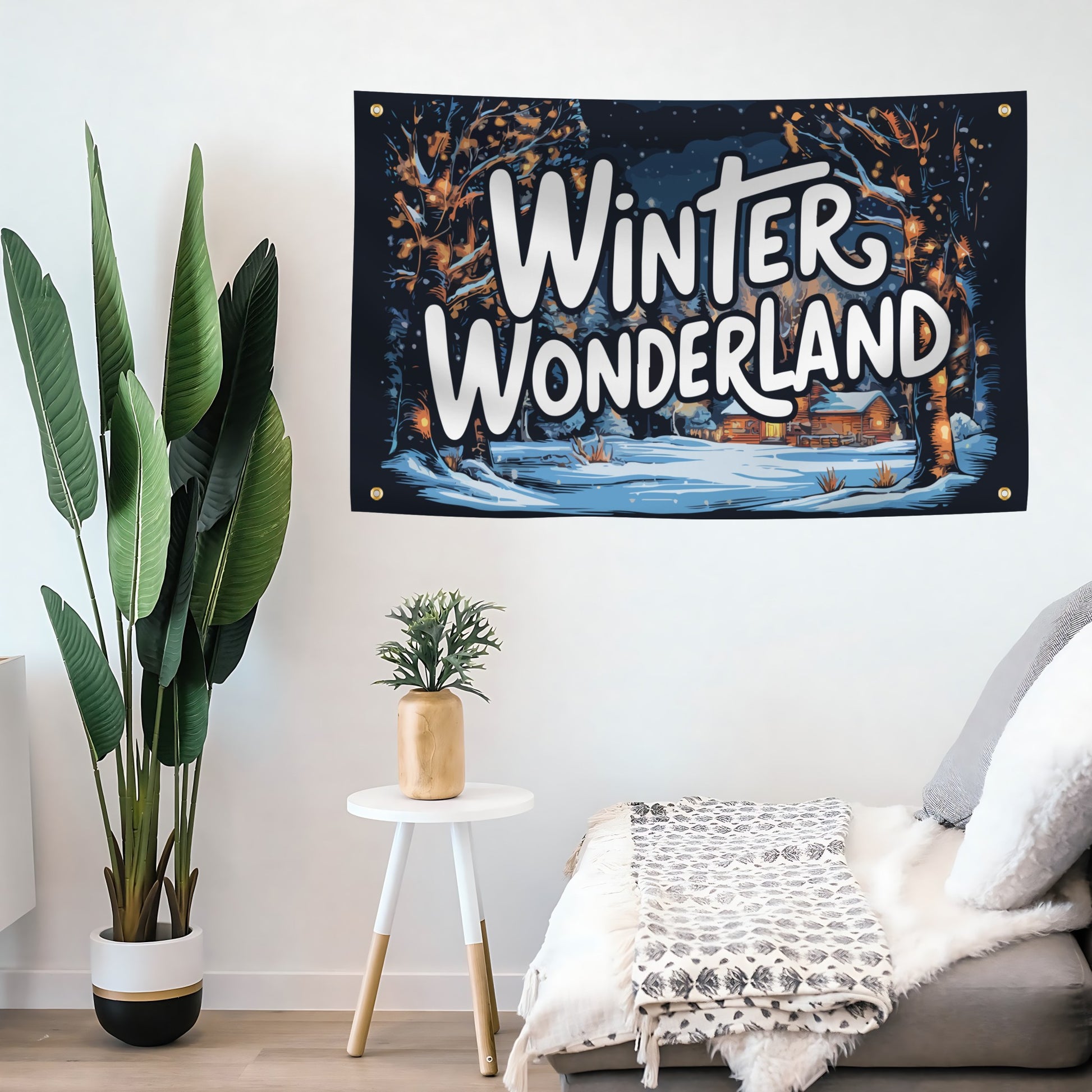 Decorative tapestry with 'Winter Wonderland' text hanging on a wall above a sofa.