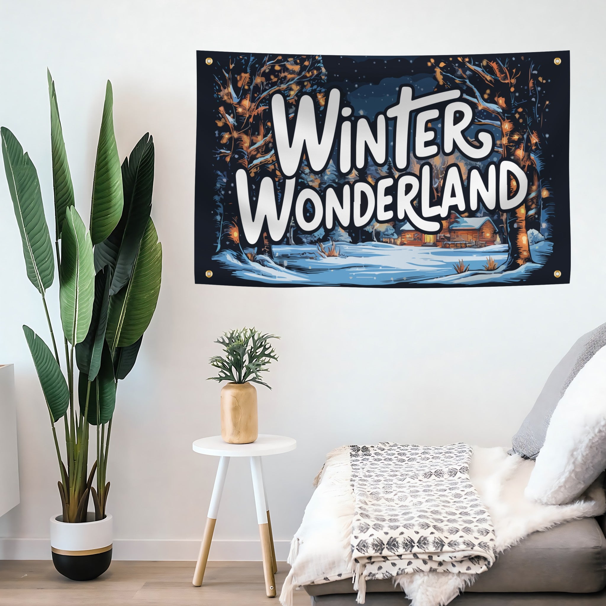 Decorative tapestry with 'Winter Wonderland' text hanging on a wall above a sofa.