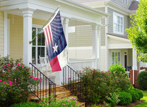 a texas flag on a porch of a house