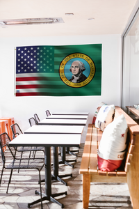 a room with tables and chairs and a flag hanging on the wall