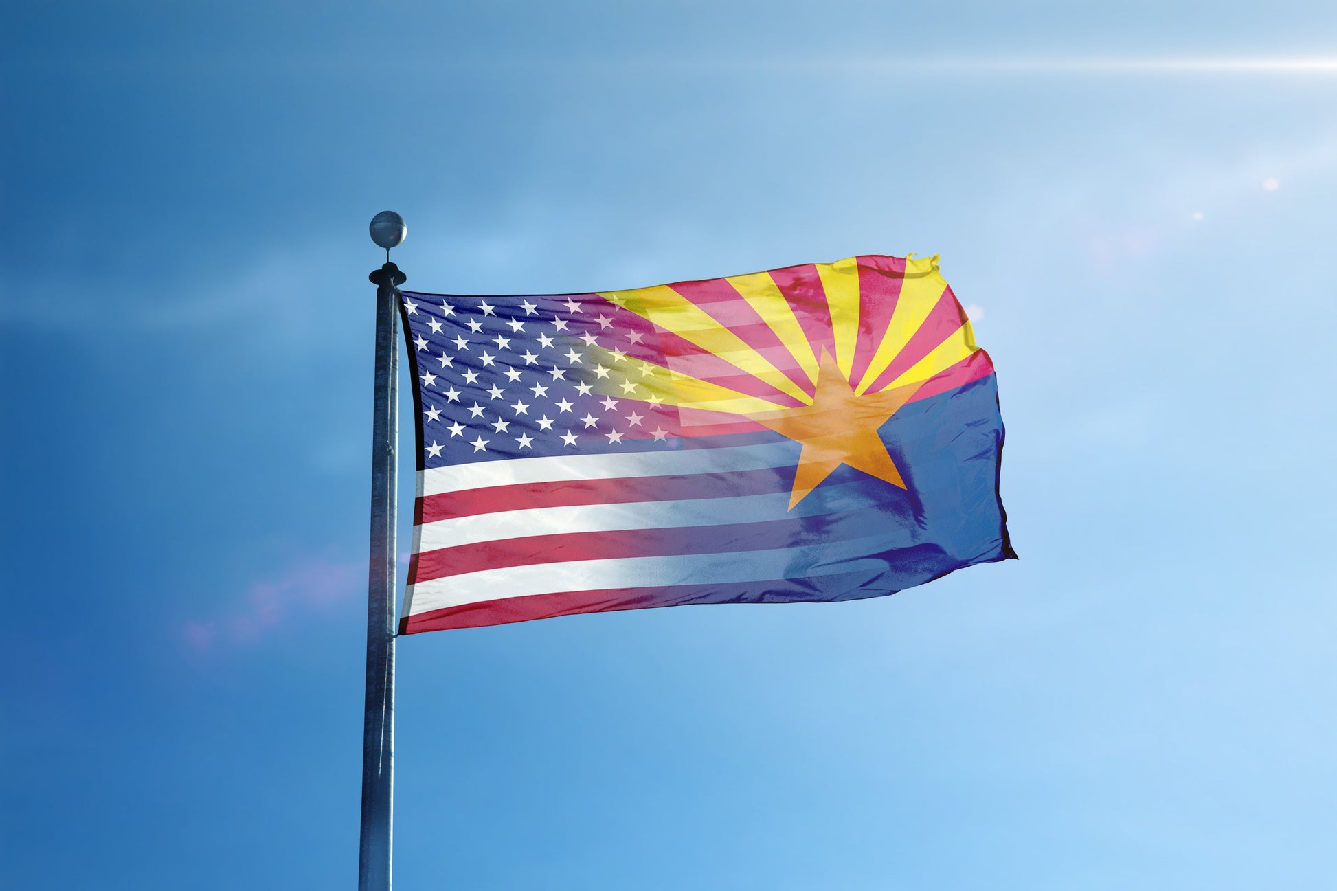 a flag flying in the wind on a sunny day