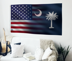 a living room with a couch and a flag on the wall