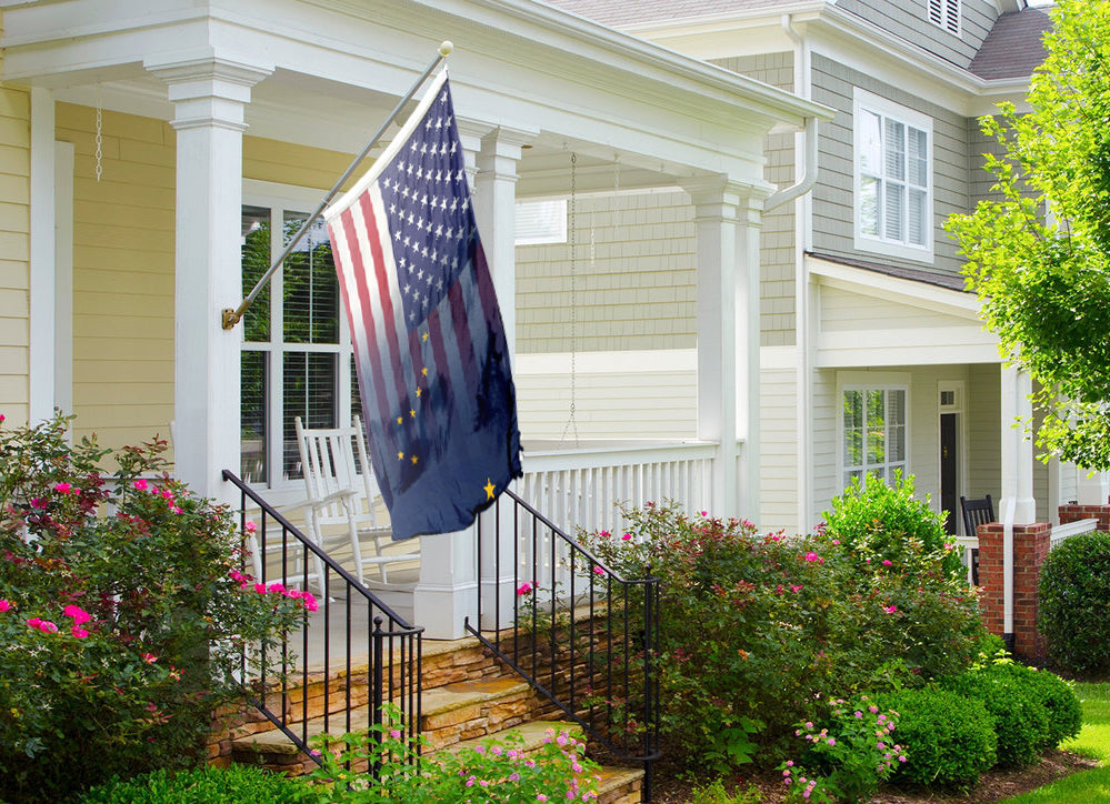 an american flag on a porch of a house