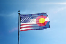 Load image into Gallery viewer, the flag of the state of colorado flying in the wind
