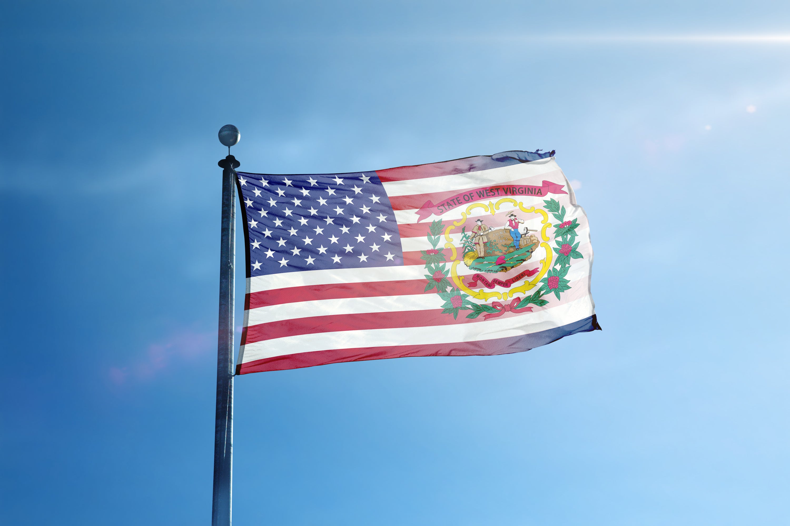 a flag flying in the wind on a sunny day